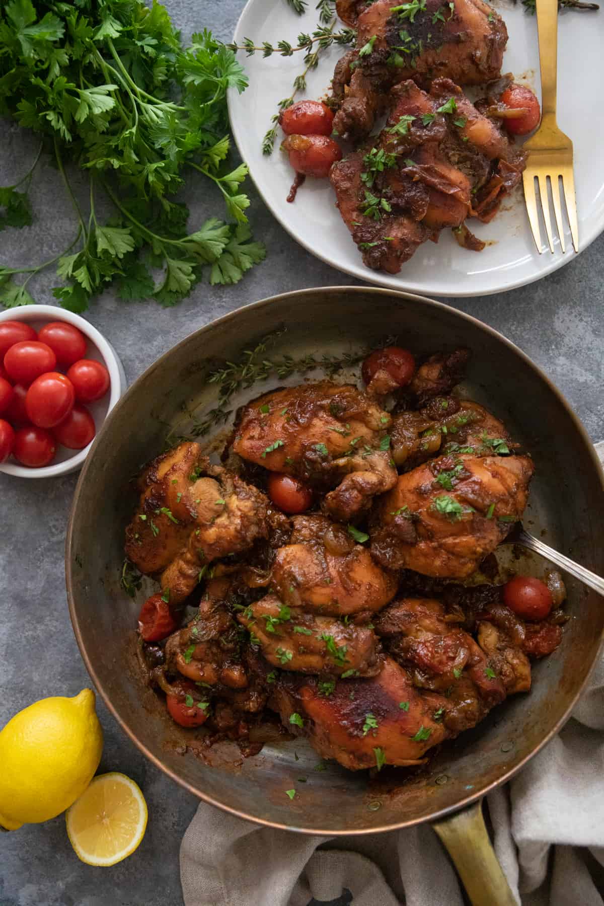 chicken in a pan and also served on a plate.