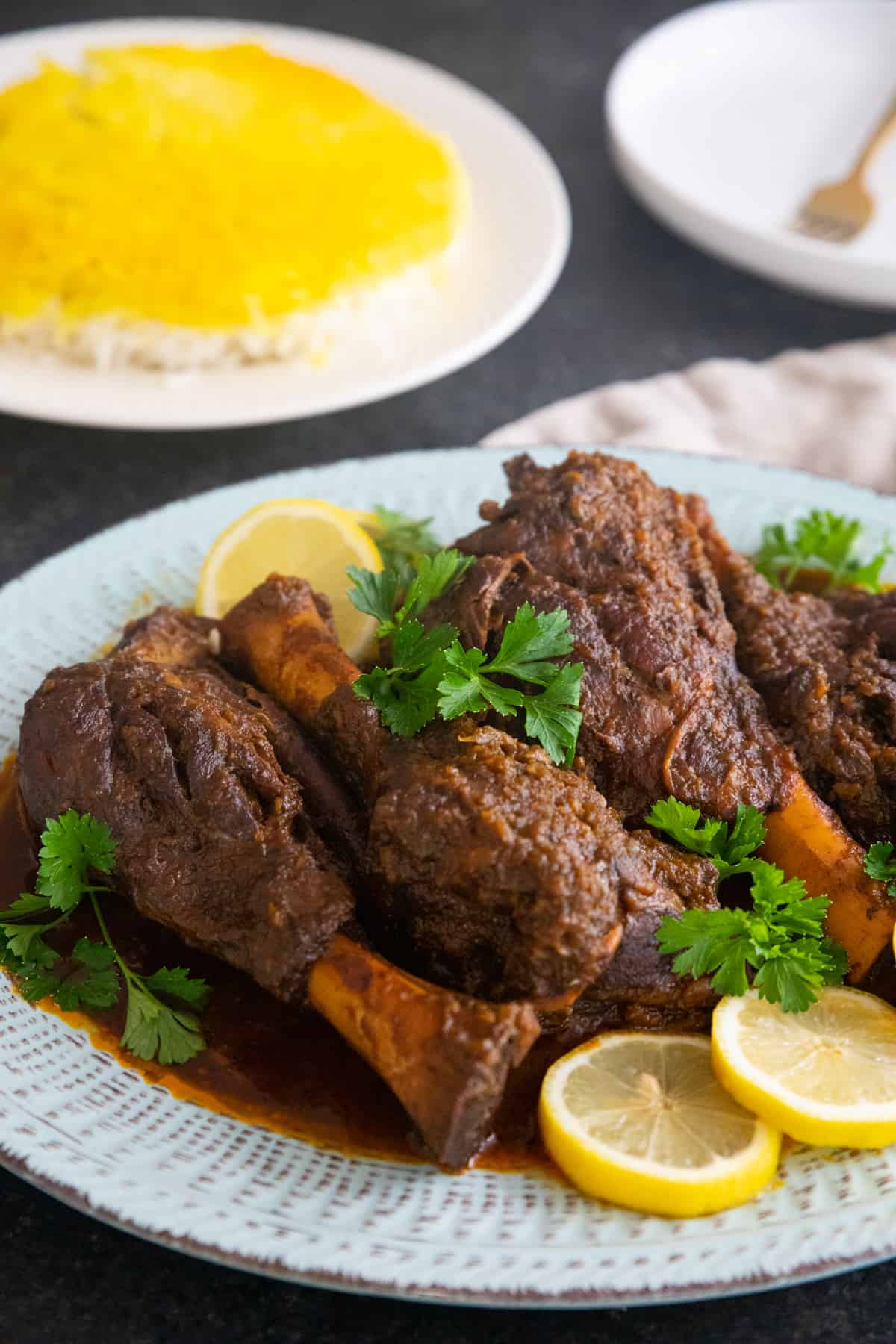 closeup shot of braised lamb shanks.