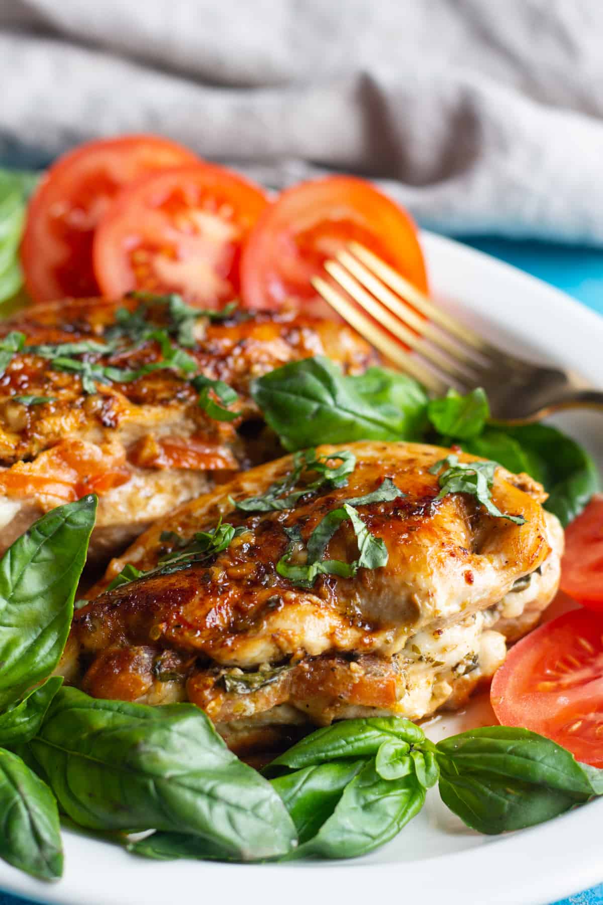 Caprese stuffed chicken breast is easy and packed with flavor. Juicy chicken breast stuffed with cheese, tomatoes and basil makes a delicious meal. 