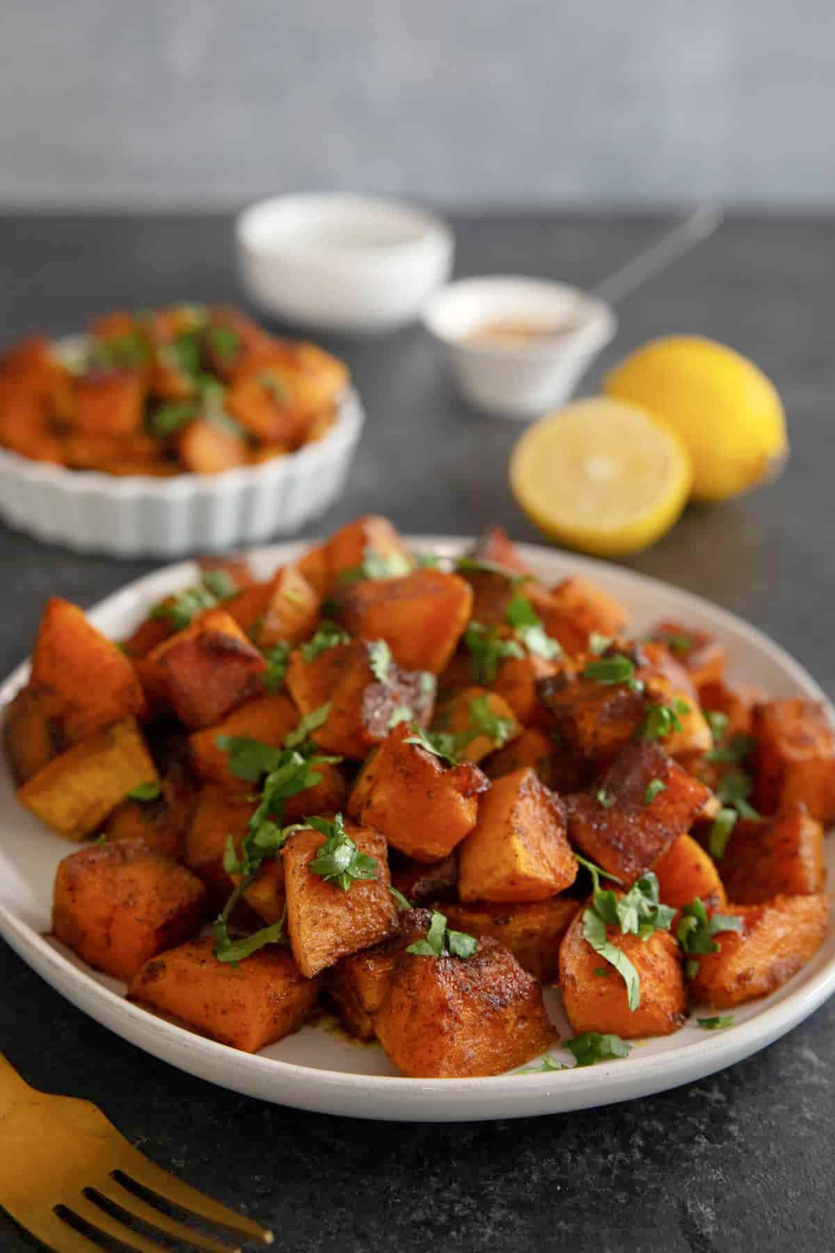 Roasted butternut squash makes an elegant side dish for any occasion. Butternut squash cubes are tossed with olive oil and warm spices and roasted until caramelized, then topped with honey, lemon and cilantro.
