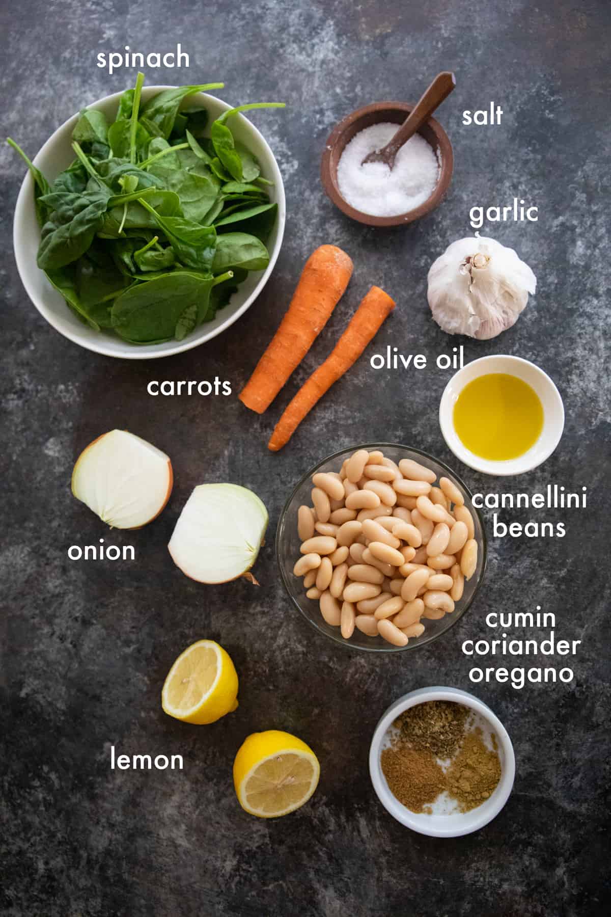 to make this recipe you need olive oil, onion, garlic, carrots, spices, white bean, vegetable stock and spinach. 