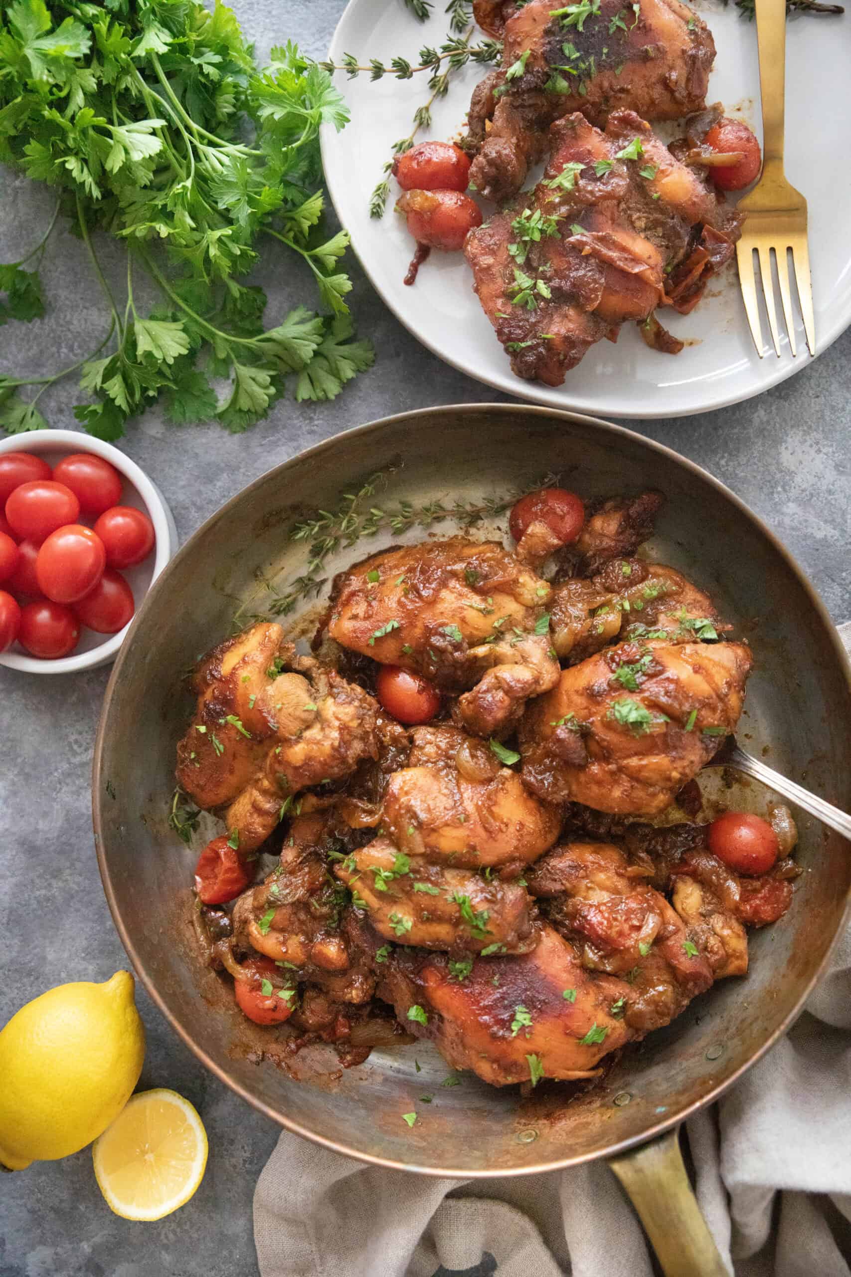 chicken in a pan and also served on a plate.