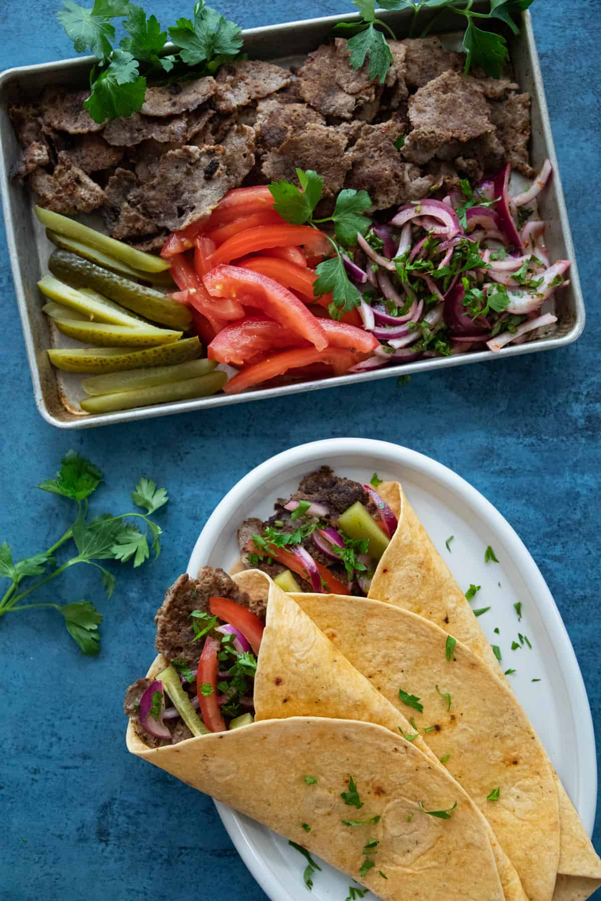 Doner kebab wraps and platter with fixings. 