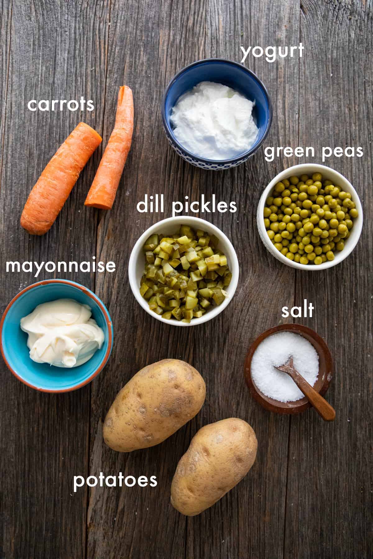 For this recipe you need potatoes, carrots, peas, dill pickles, yogurt, mayonnaise and salt.
