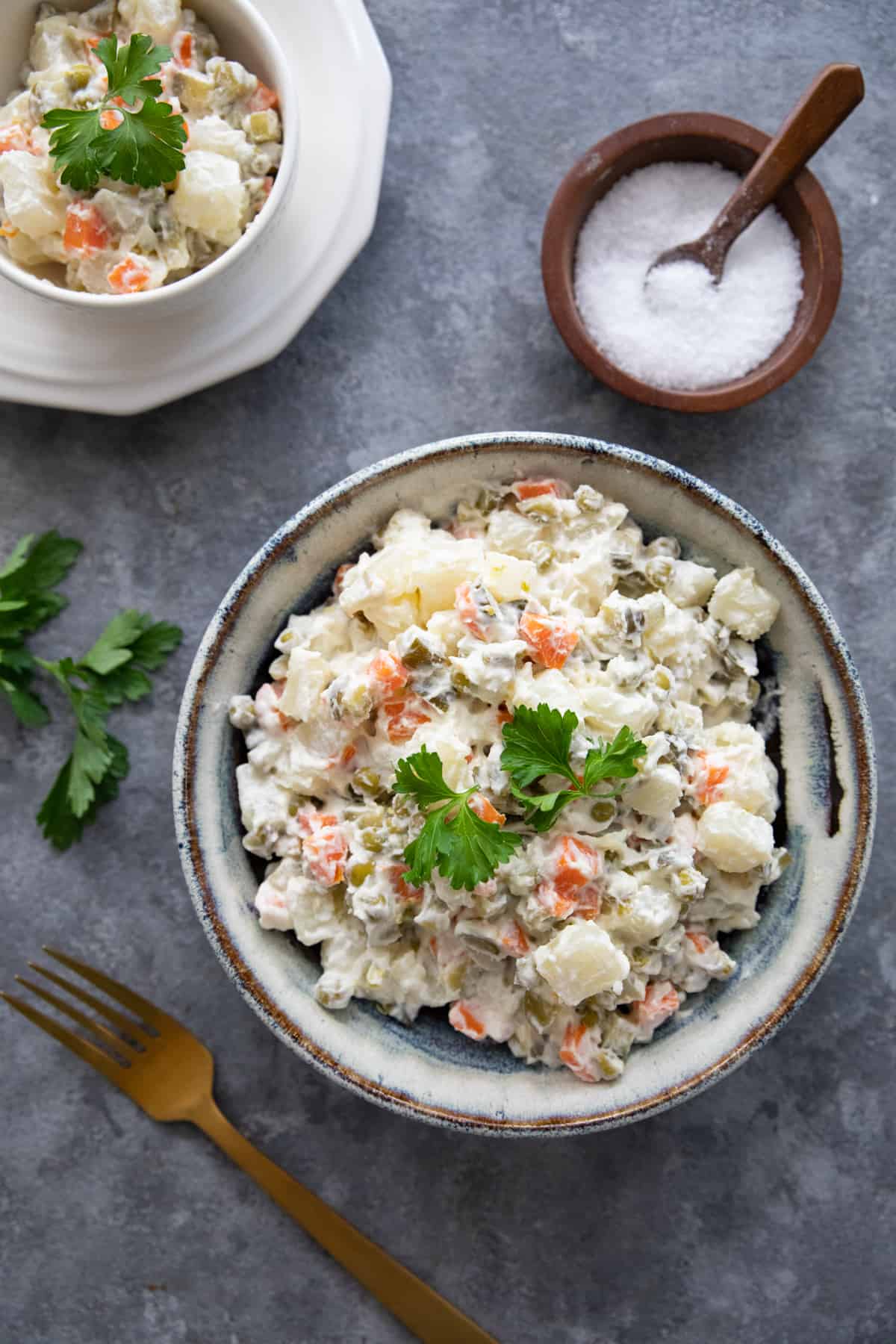 two bowls of ensalata rusa known as olivier salad or Russian salad.
