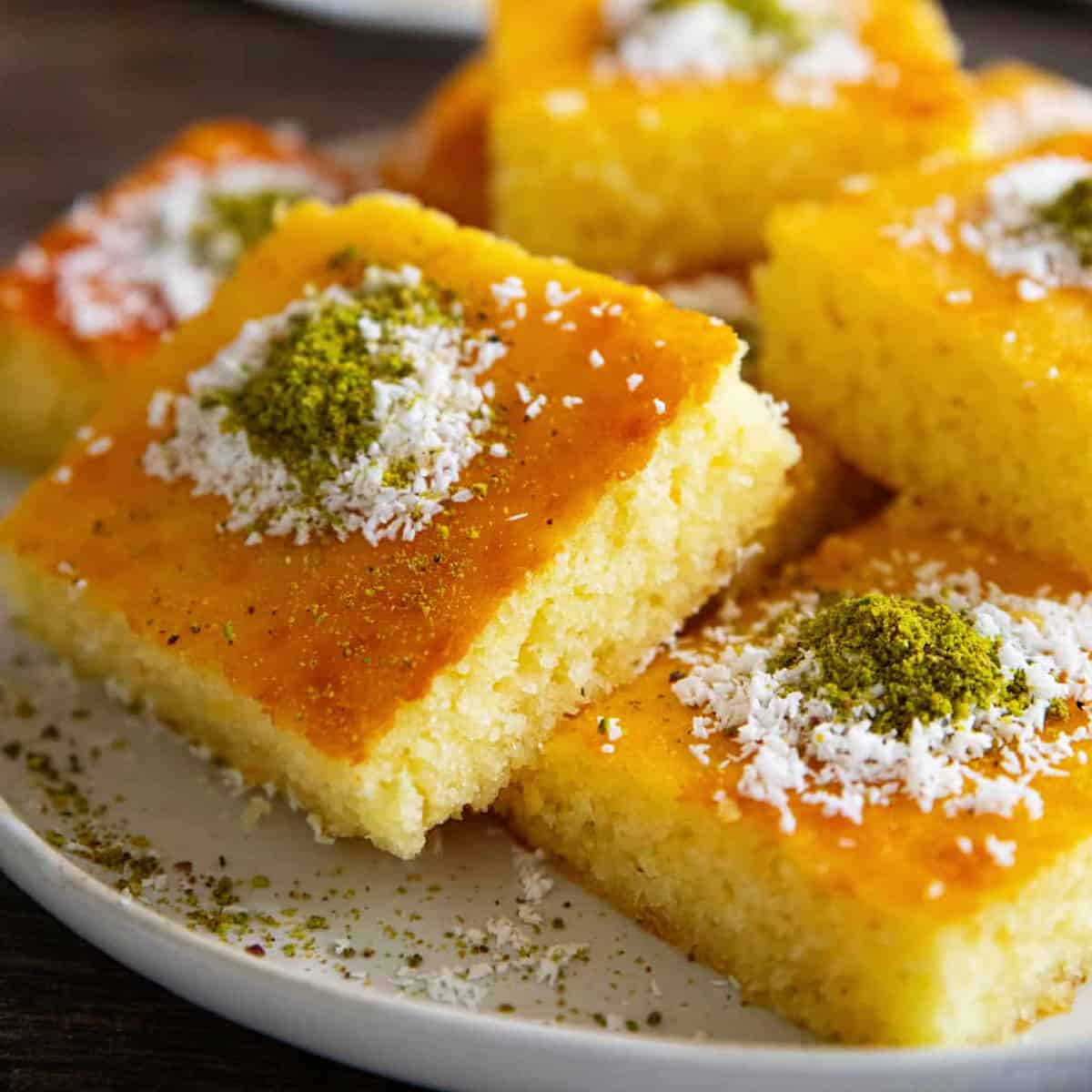 Revani is a classic semolina cake that's easy and so delicious. Soaked in a light simple syrup, this cake is popular throughout the Middle East and Mediterranean.
