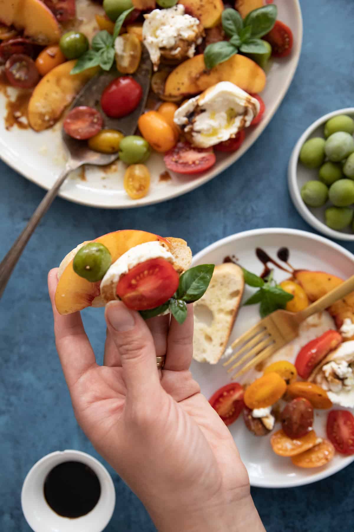 Burrata and tomatoes on a piece of bread. 