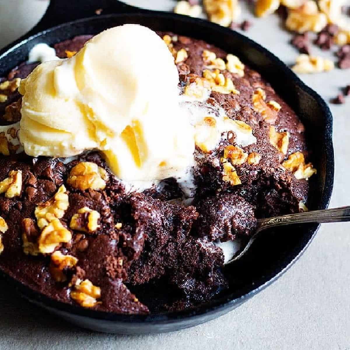 Nothing beats a good ooey gooey Double Chocolate Walnut Skillet Brownie with a large glass of milk. You'll need only a few ingredients to make this delicious skillet brownie!
