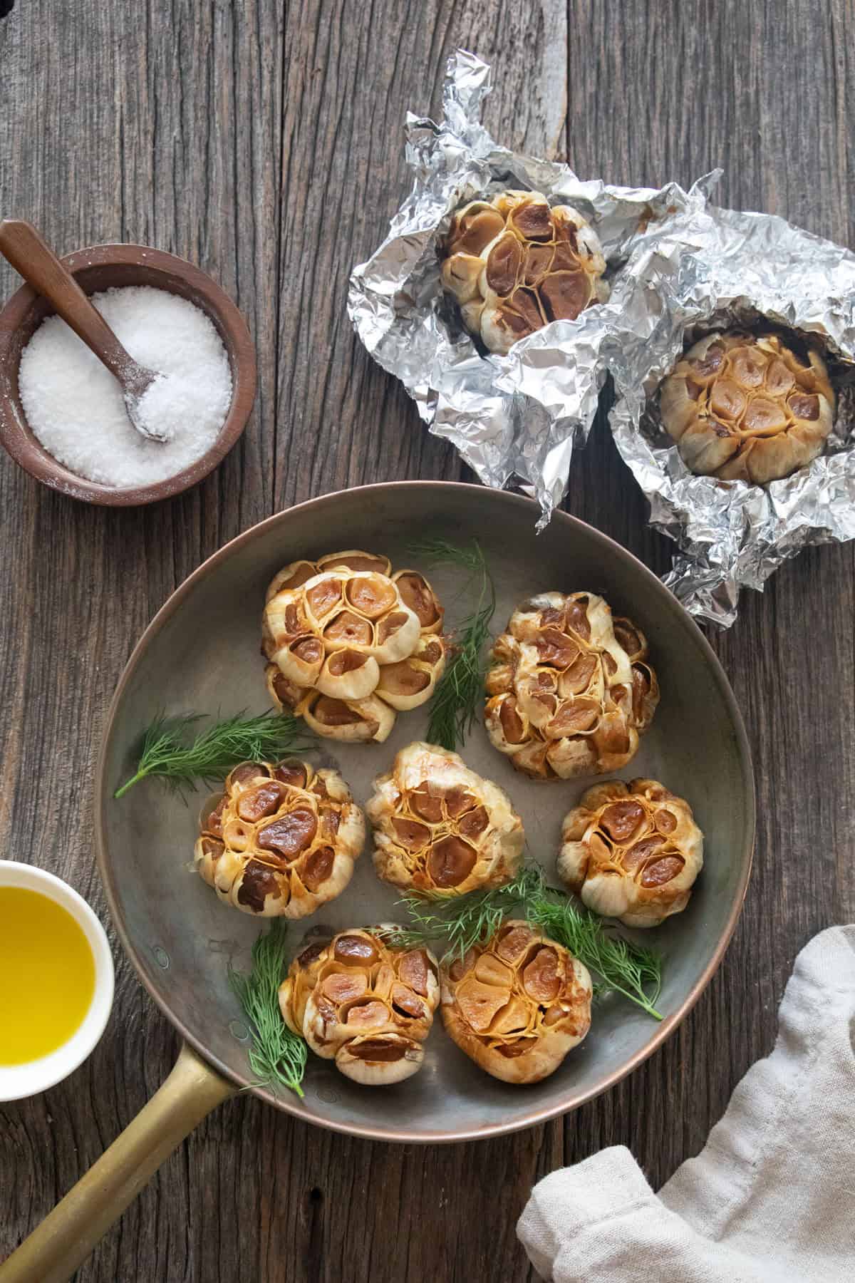 roast garlic bulbs with olive oil wrapped in aluminum foil.