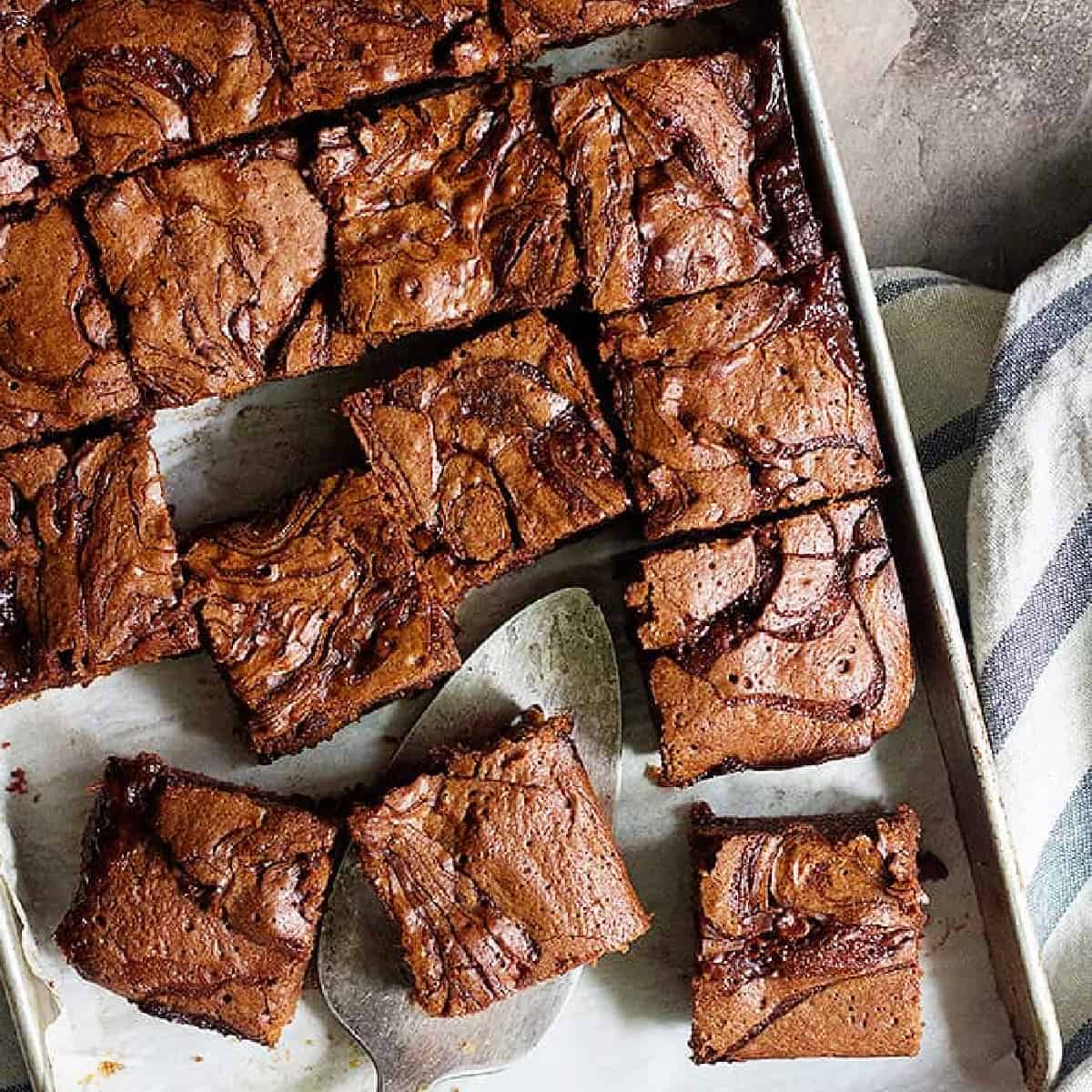 Let's talk caramel brownies! Fudgy chocolate brownies with a caramel swirl that will make you want to eat the whole pan! These caramel brownies are super good!
