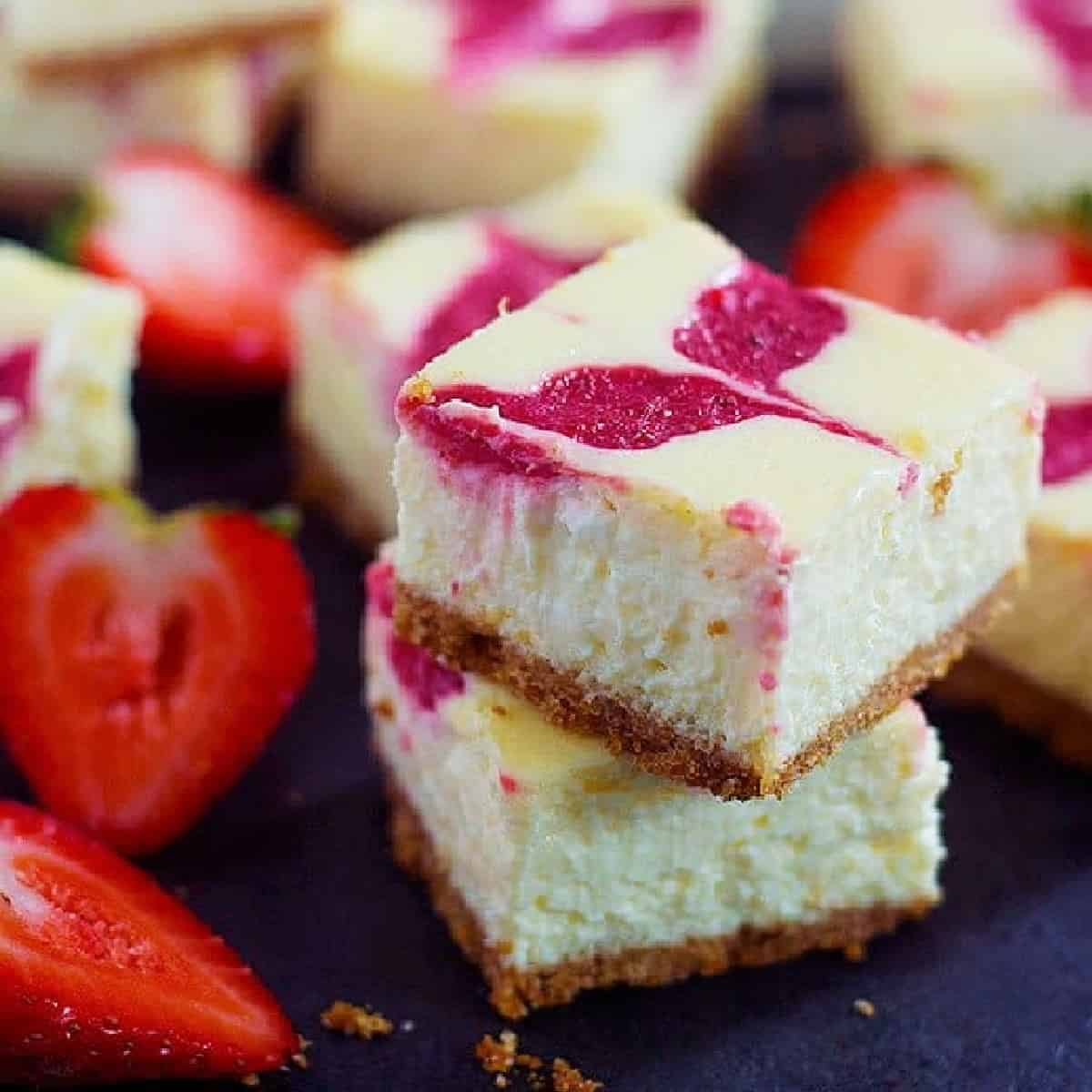 Strawberry Swirl Cheesecake Bars can be your easy, go to dessert recipe this summer. Everyone loves a creamy and luscious cheesecake topped with delicious homemade strawberry swirl.
