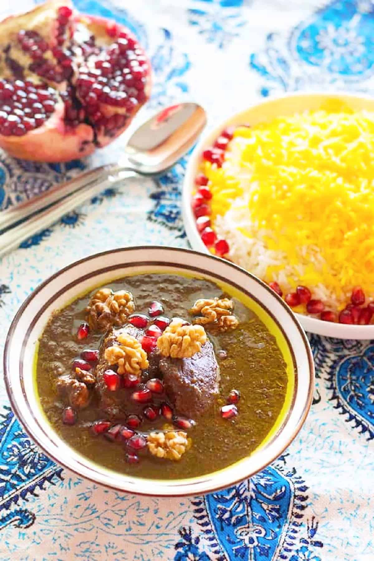 Dive into Persian deliciousness! Fesenjan stew is a wonderful Persian concoction made with chicken, pomegranates and walnuts served with rice for a perfect meal with bold flavors! 
