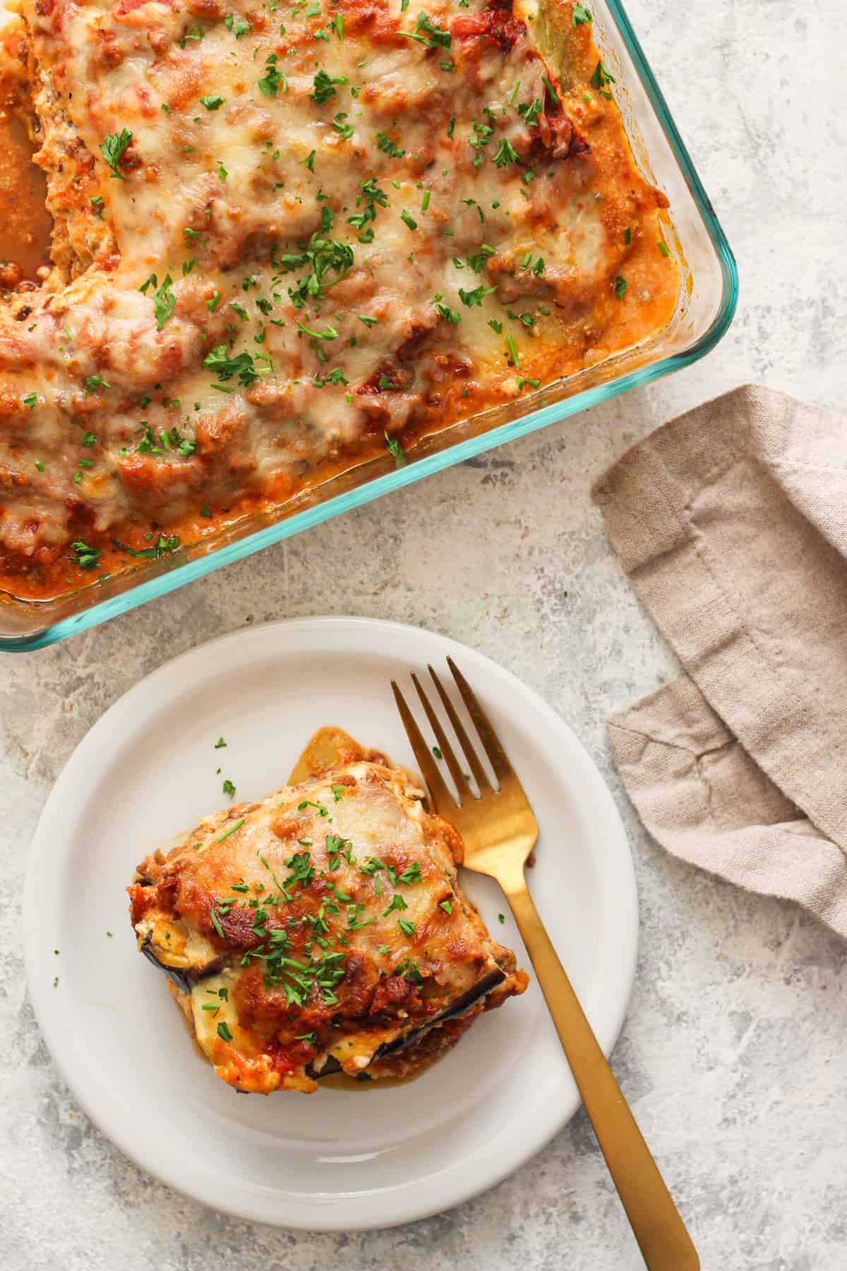 This eggplant lasagna is absolutely cheesy and rich in flavor with layers of eggplant, delicious meat sauce and 3 kinds of cheese! It's made without any noodles, so it's gluten free and low carb. This is a great recipe to use up those eggplants sitting in the fridge. Watch the video to see how to make this recipe, vegetarian option also included!