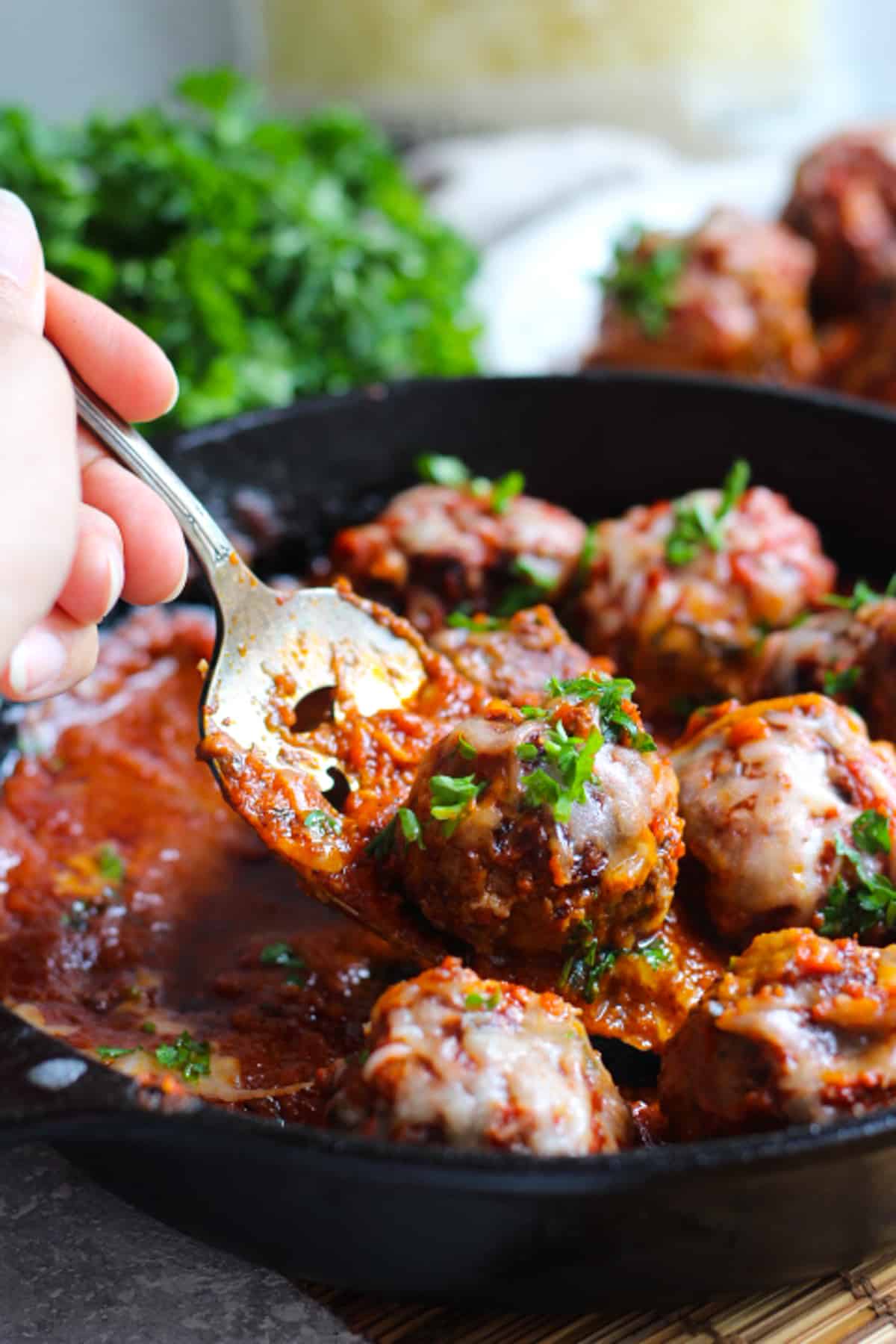 Homemade Italian meatballs are perfect for dinner. These are made with ground beef and are so juicy and tender. Cooked in tomato sauce and topped with mozzarella, you can enjoy these meatballs in a sub, with salad, potatoes or pasta! So easy and simple to make and they're perfect for meal prep. 