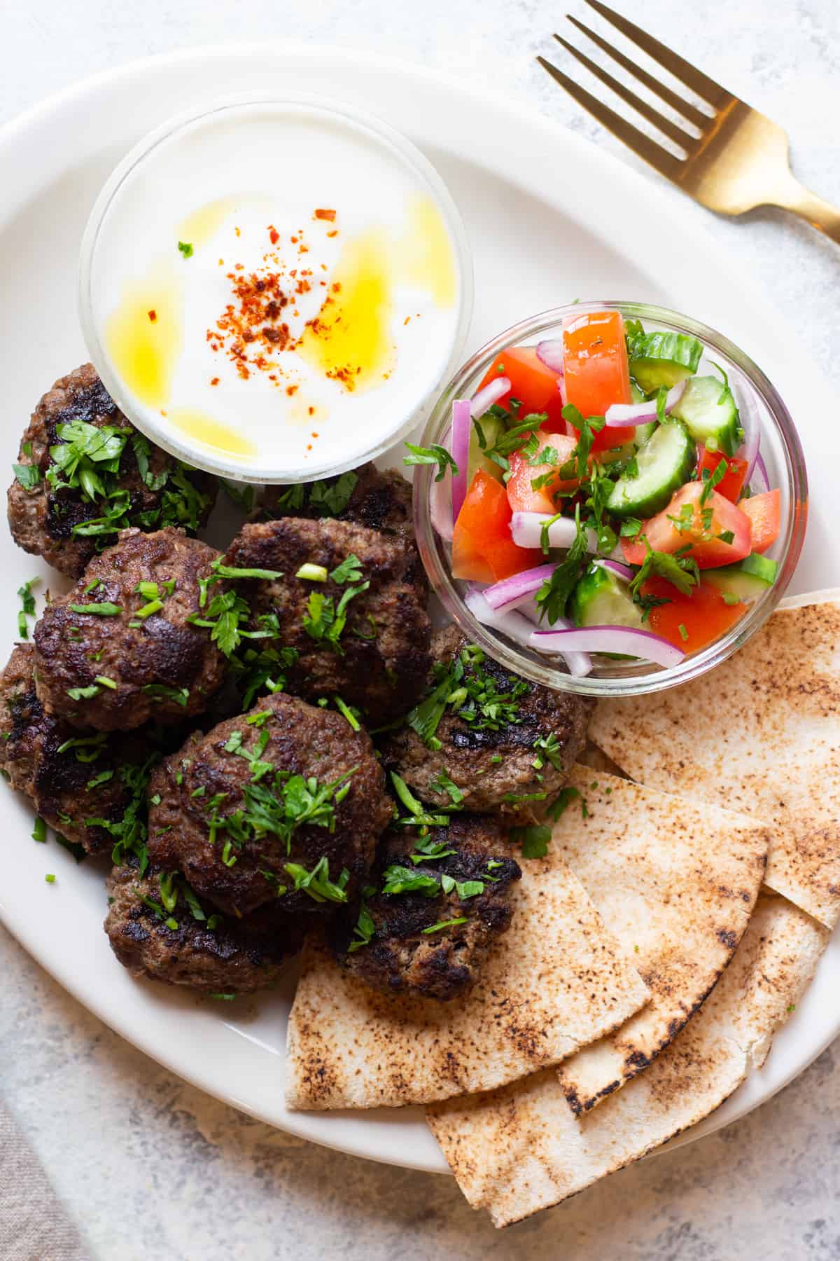 This is the best kofta kebab recipe! So easy and simple, made with just a few ingredients and ready in no time! These koftas are juicy and so delicious. For the perfect meal serve them with pita, salad and a delicious yogurt sauce. 