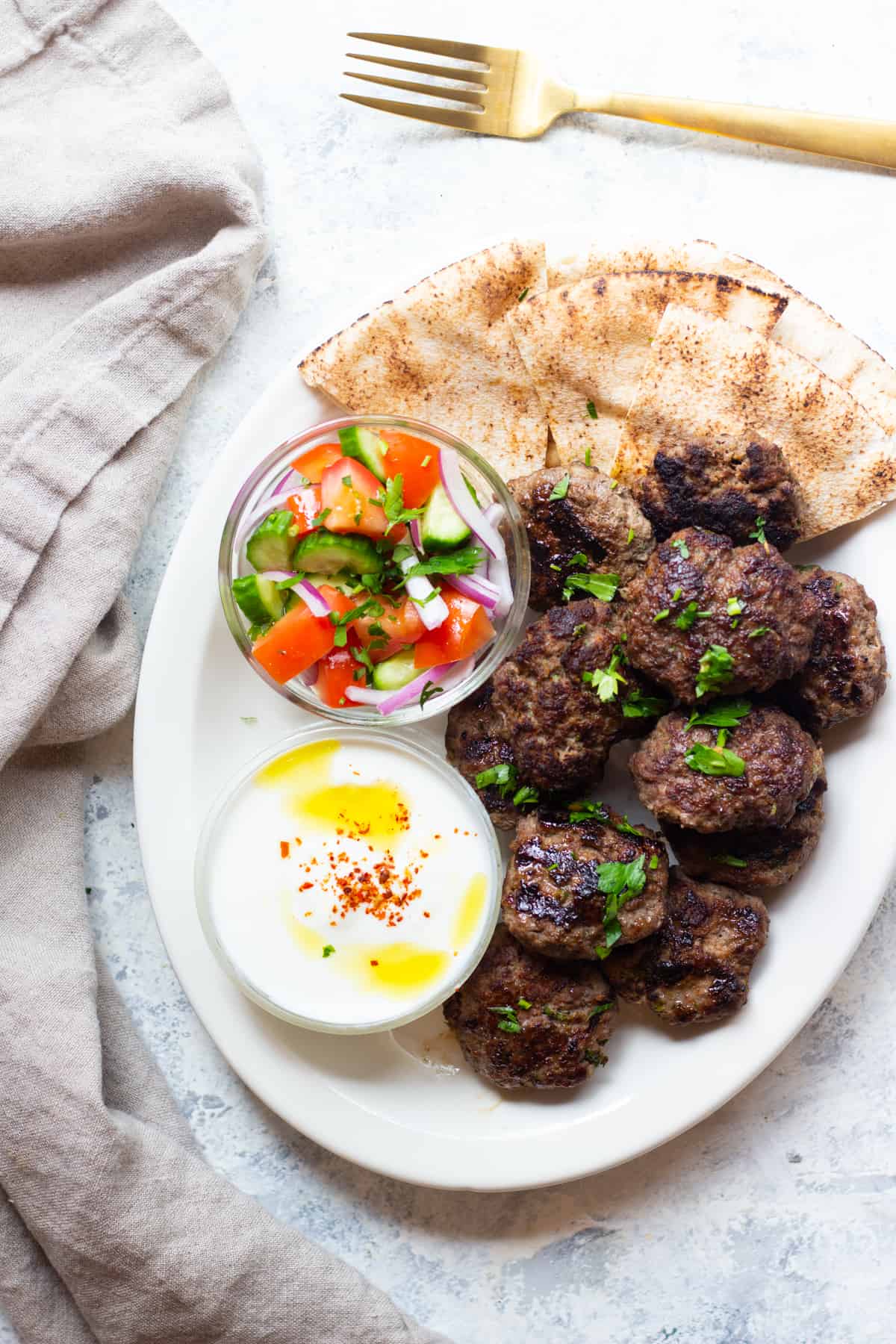 Kofta kebab is a classic Middle Eastern ground beef recipe that's packed with flavor. Learn how to make kofta kebab with my step by step tutorial and video. 
