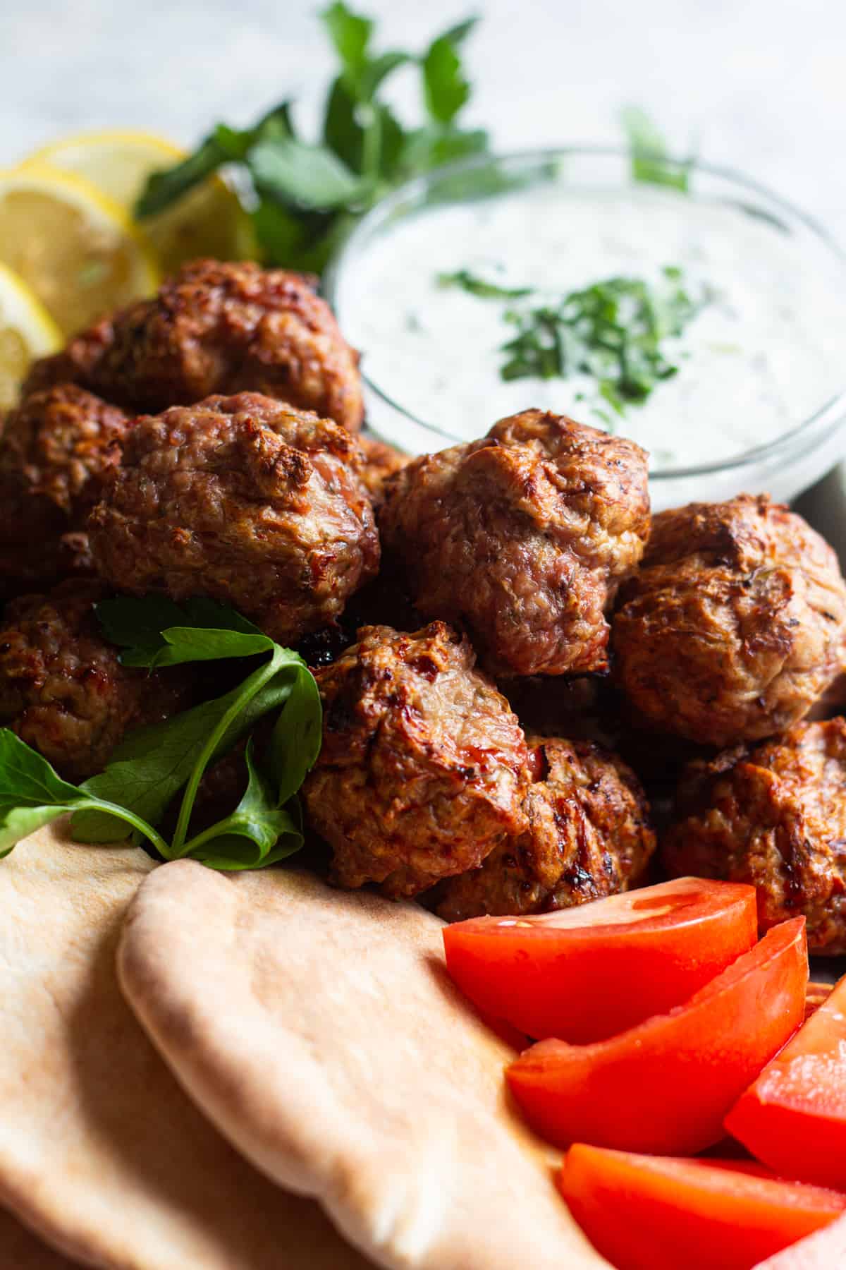 Oven baked turkey meatballs with a Mediterranean twist! These healthy baked meatballs are perfect for a quick dinner or meal prepping and are ready in no time! You can serve them with rice or pita bread, tomatoes, cucumbers and tzatziki! Simple yet so delicious! 