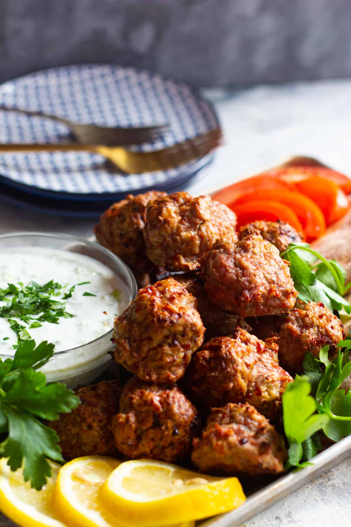 Oven baked turkey meatballs with a Mediterranean twist! These healthy baked meatballs are perfect for a quick dinner or meal prepping and are ready in no time! You can serve them with rice or pita bread, tomatoes, cucumbers and tzatziki! Simple yet so delicious! 