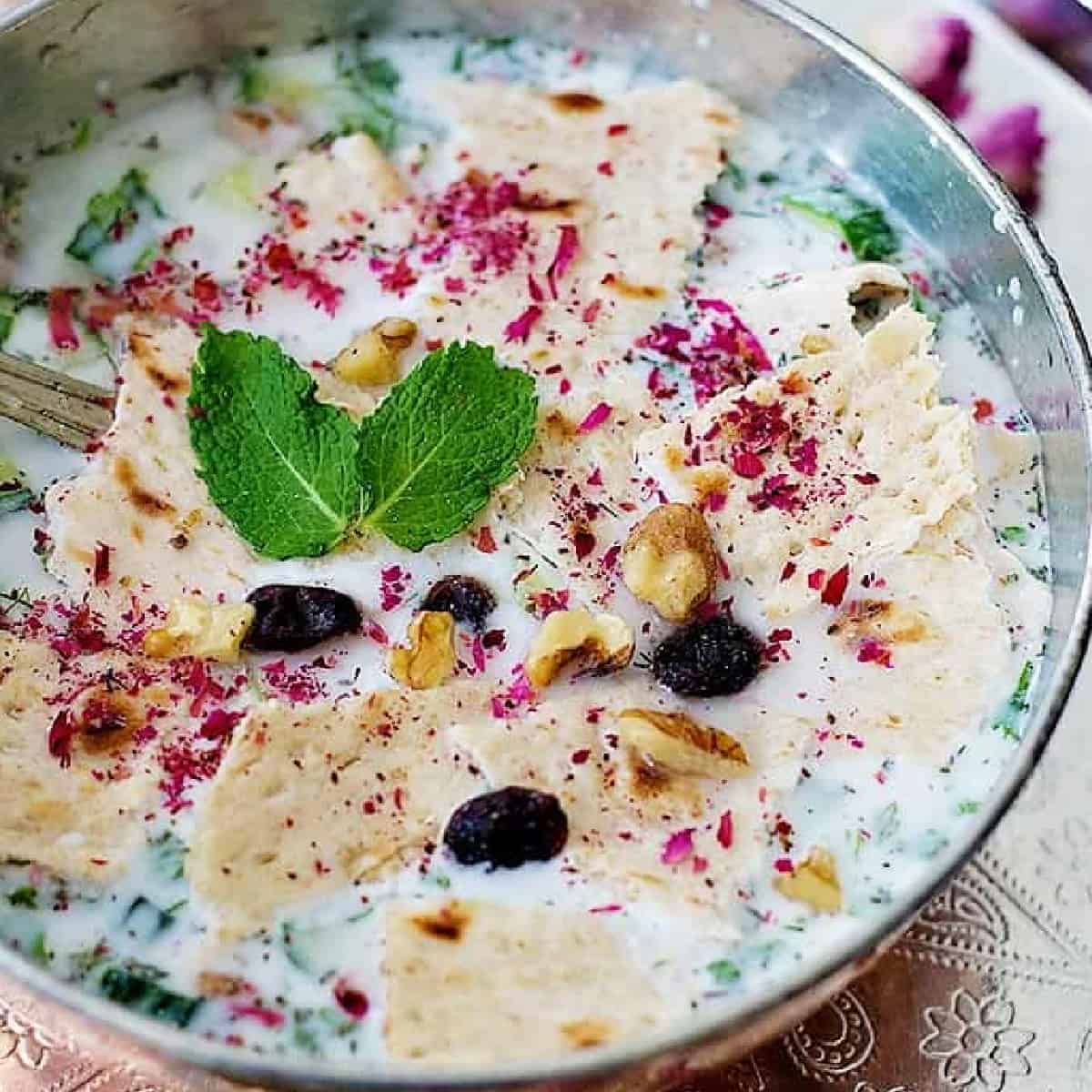 Stay cool this summer with this Persian Cold Yogurt Soup - Abdoogh Khiar. This tasty yogurt soup is made with simple, natural and healthy ingredients and is ready in 15 minutes.
