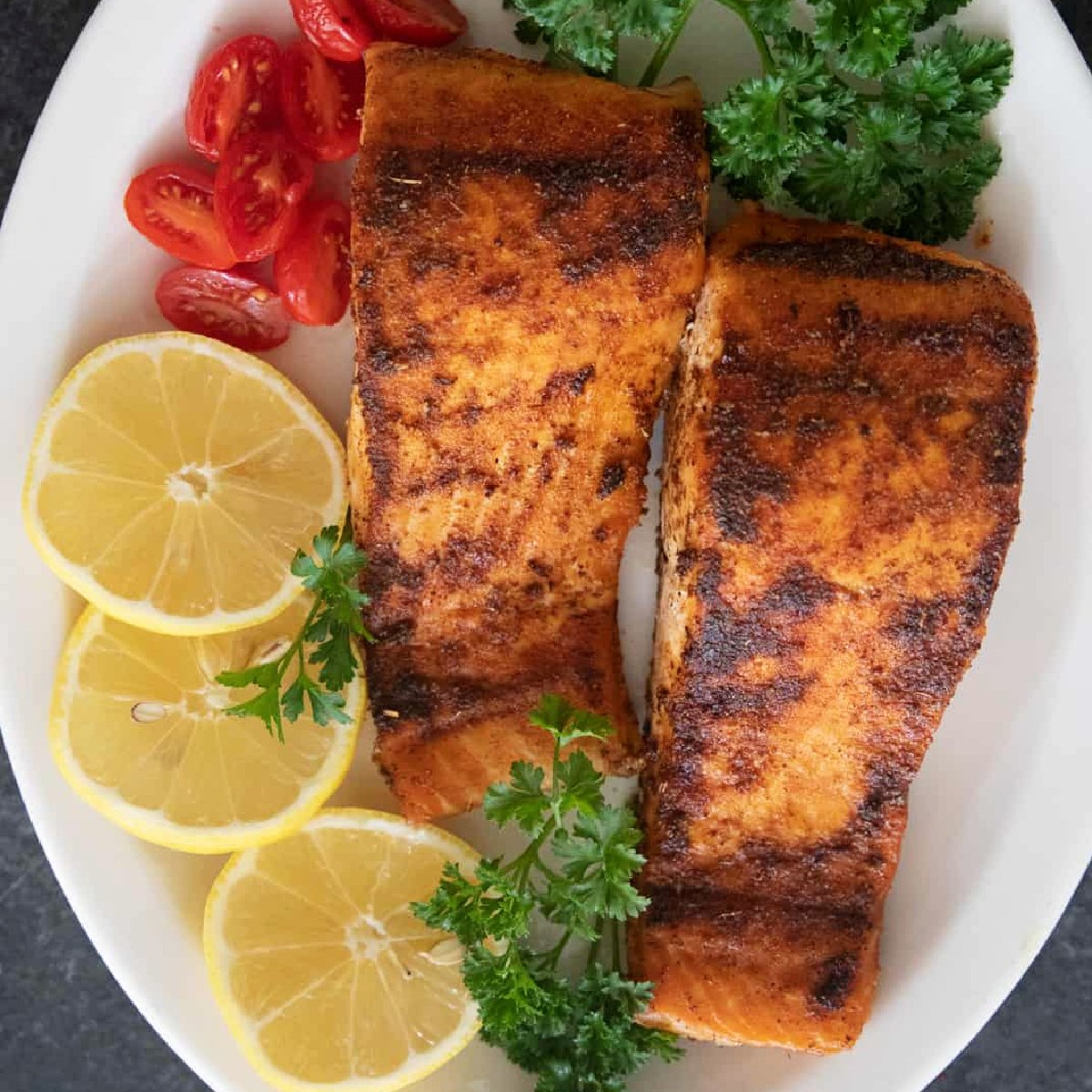 Make the best blackened salmon recipe in 20 minutes! For this dish, salmon fillets are coated with blackening seasoning and seared until flaky and tender. Turn this into a tasty salmon dinner with salad, rice or potatoes.