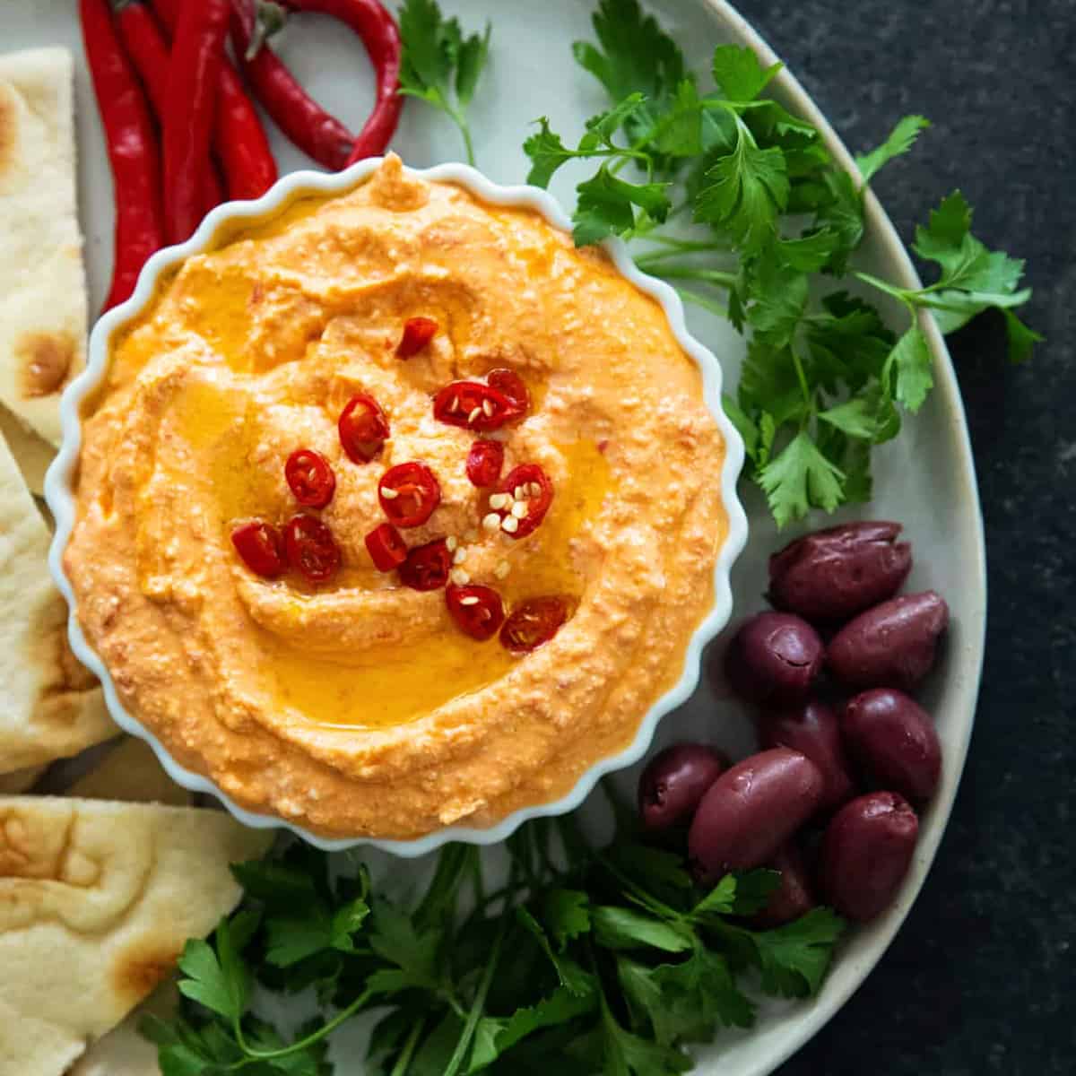 Tirokafteri is a classic spicy Greek feta dip that's ready in 5 minutes. Made with creamy feta and roasted red peppers, you can enjoy this dip as part of a mezze platter with some pita bread.
