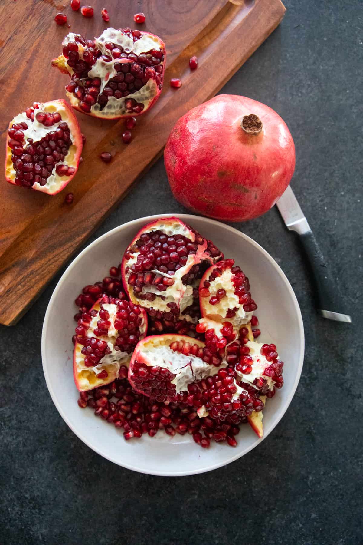 Pomegranate pieces on in a bowl.