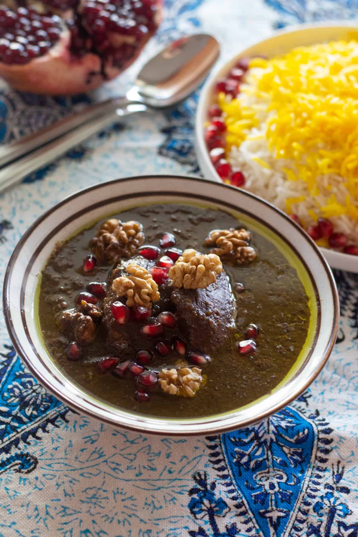 Fesenjan is a traditional Persian pomegranate and walnut chicken stew. It's sweet and sour with a rich nutty flavor and served over rice. The chicken is cooked in a rich walnut and pomegranate sauce until tender, making this a luscious and delicious meal. 