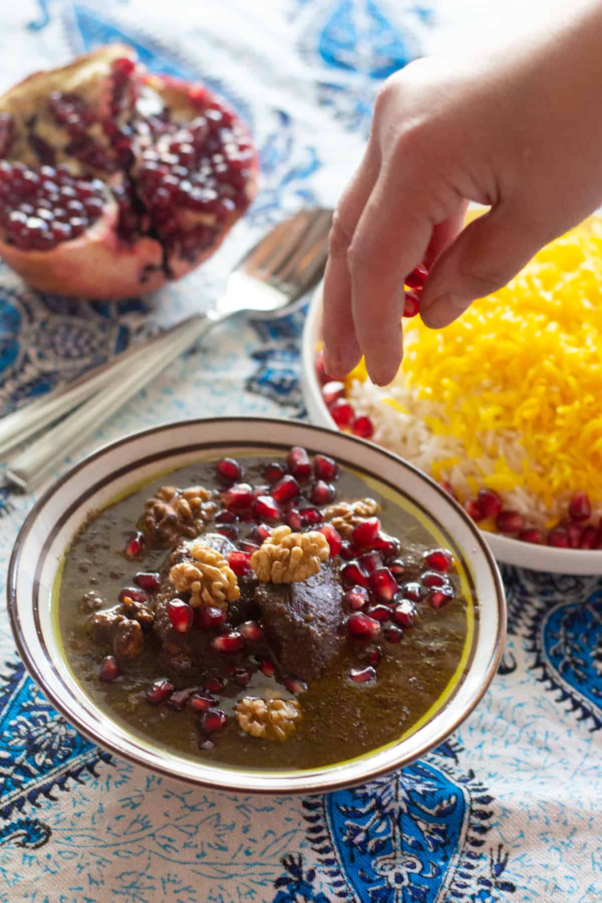 Fesenjan is a traditional Persian pomegranate and walnut chicken stew. It's sweet and sour with a rich nutty flavor and served over rice. The chicken is cooked in a rich walnut and pomegranate sauce until tender, making this a luscious and delicious meal. 