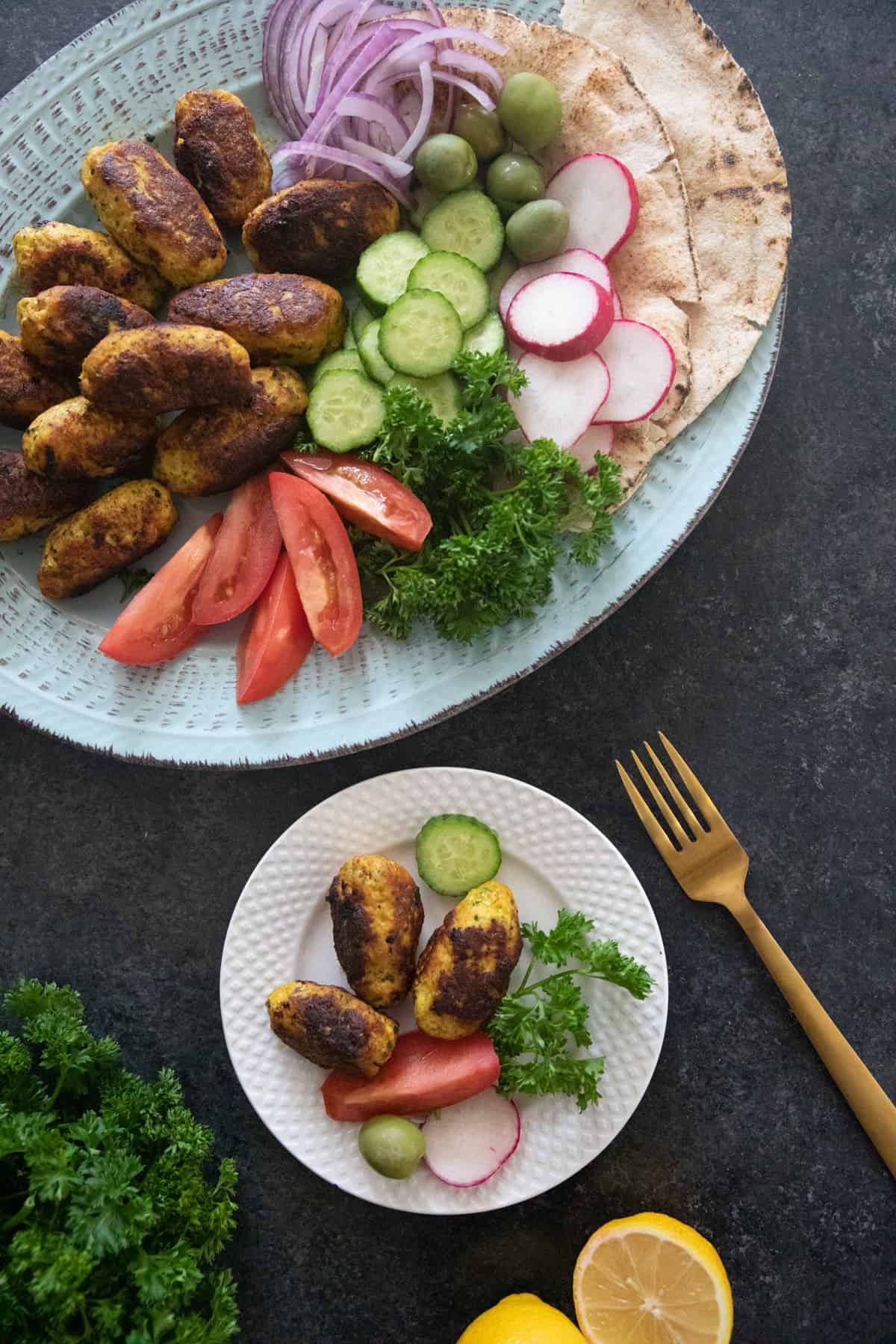 Serve chicken meatballs with vegetables and bread. 