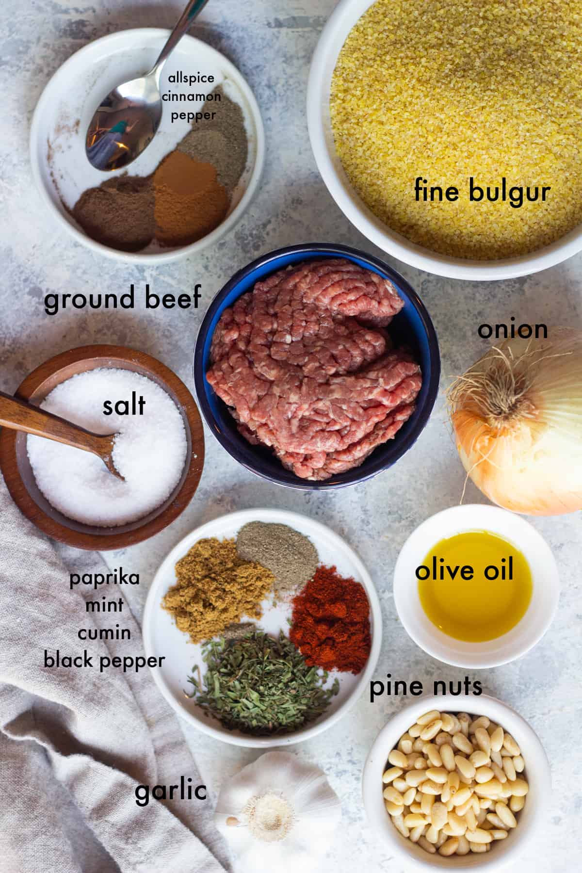 Ingredients to make kibie are ground beef, bulgur, onion, spices, salt, onion and olive oil. 