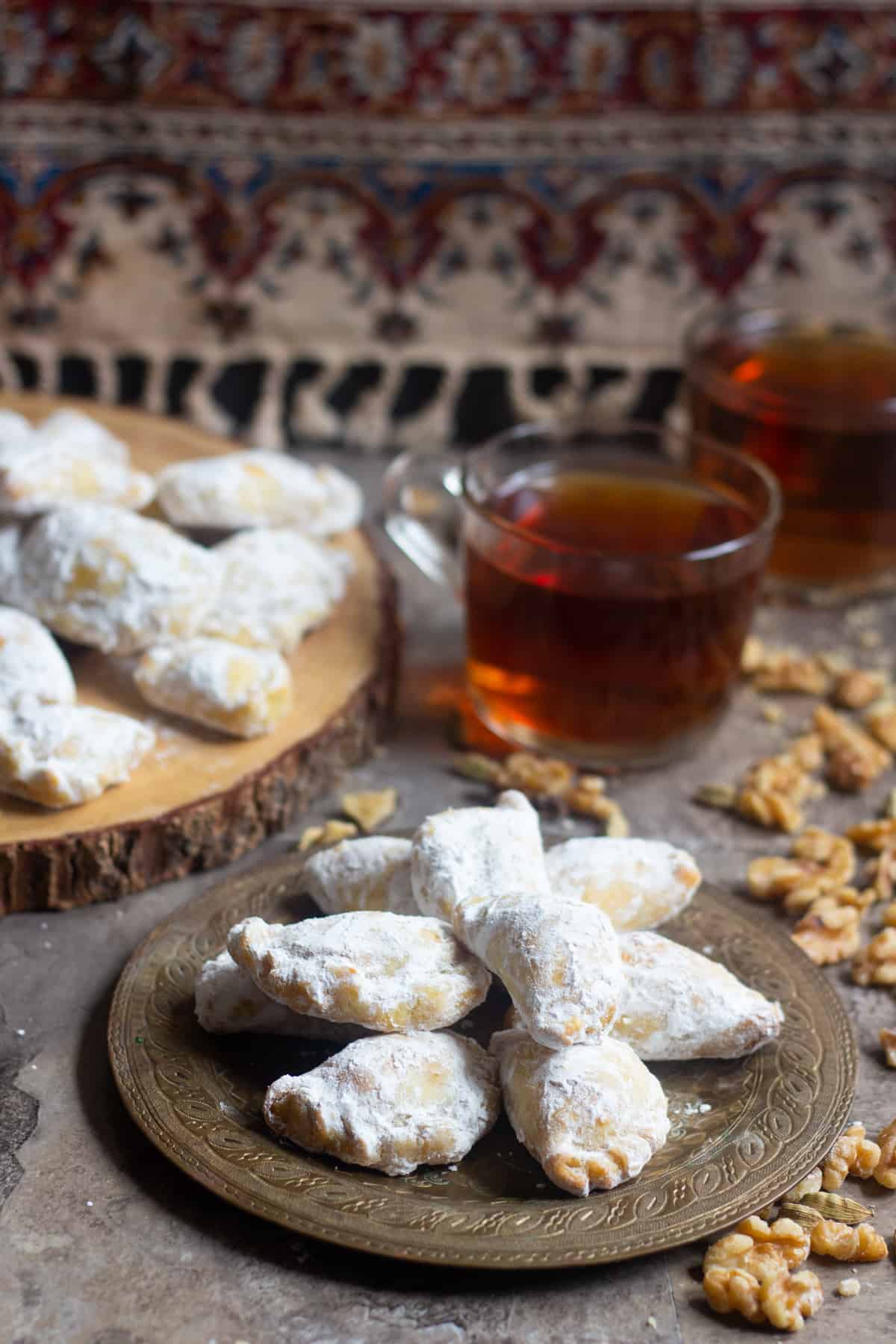 Qottab is a Persian pastry filled with walnuts is a delicious traditional treat from Iran. Delicate and flaky dough is filled with a combination of walnuts and cardamom - making this the perfect Persian dessert!