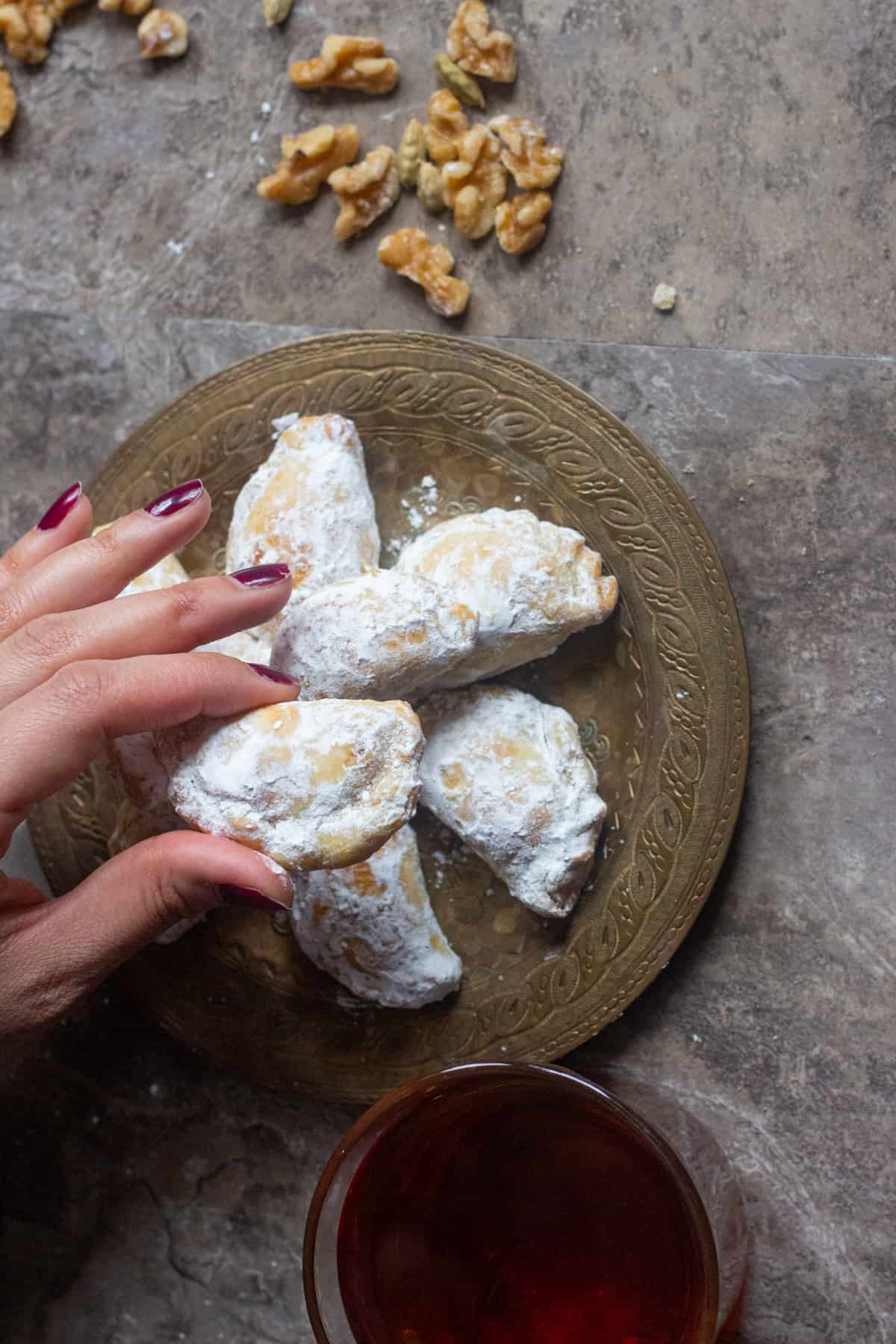 Qottab is a Persian pastry filled with walnuts is a delicious traditional treat from Iran. Delicate and flaky dough is filled with a combination of walnuts and cardamom - making this the perfect Persian dessert!