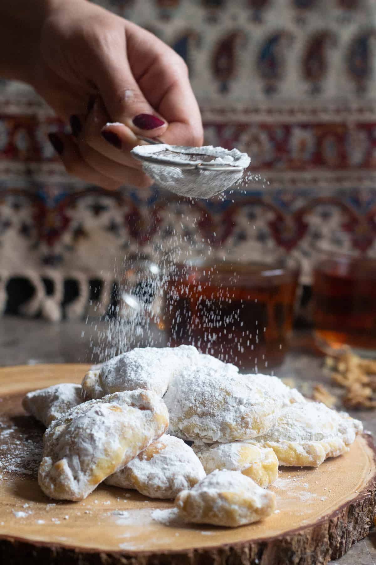 Qottab is a Persian pastry filled with walnuts is a delicious traditional treat from Iran. Delicate and flaky dough is filled with a combination of walnuts and cardamom - making this the perfect Persian dessert!