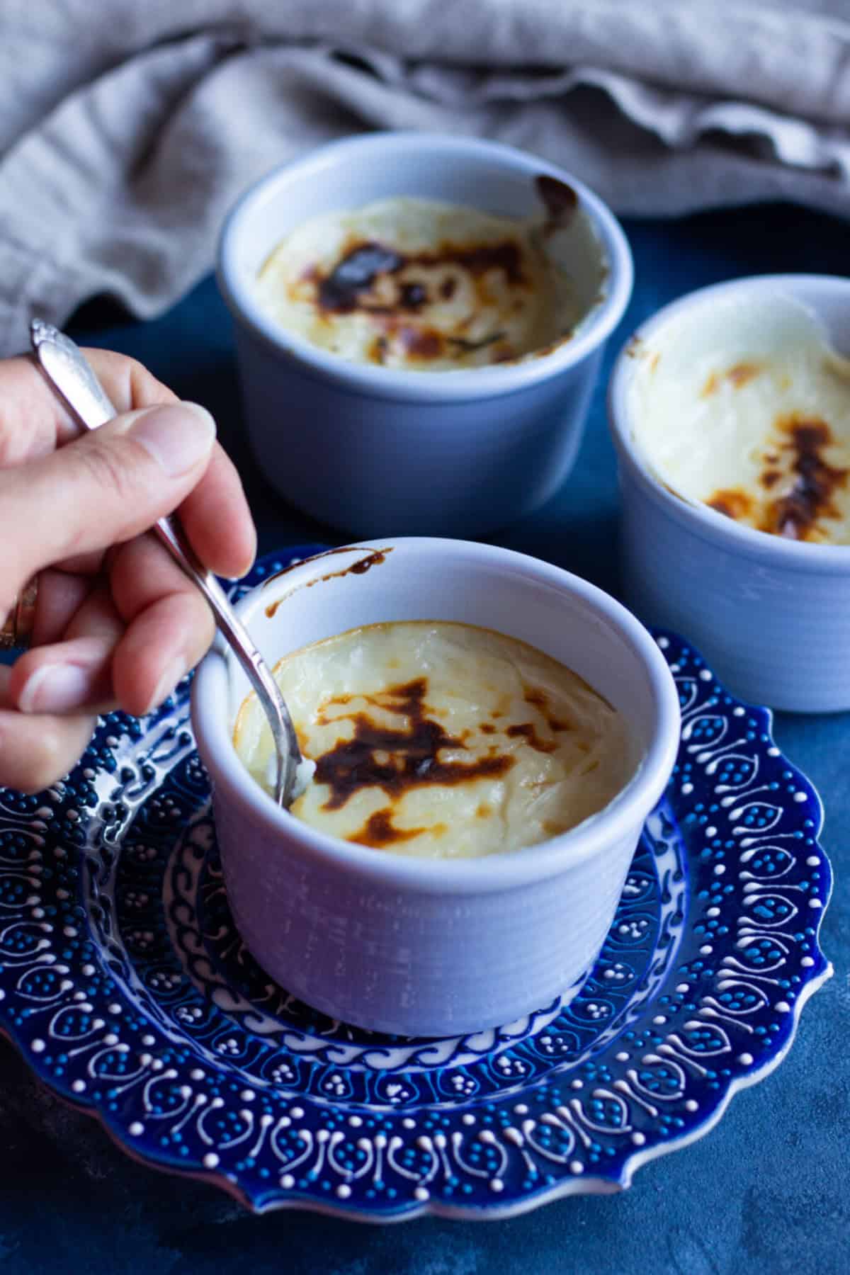 If you love light and creamy desserts, Sutlac, also known as Turkish rice pudding recipe is it. Creamy and rich with a golden top, this baked rice pudding is also gluten-free. Learn how to make this tasty dessert with this tutorial and step-by-step photos. 
