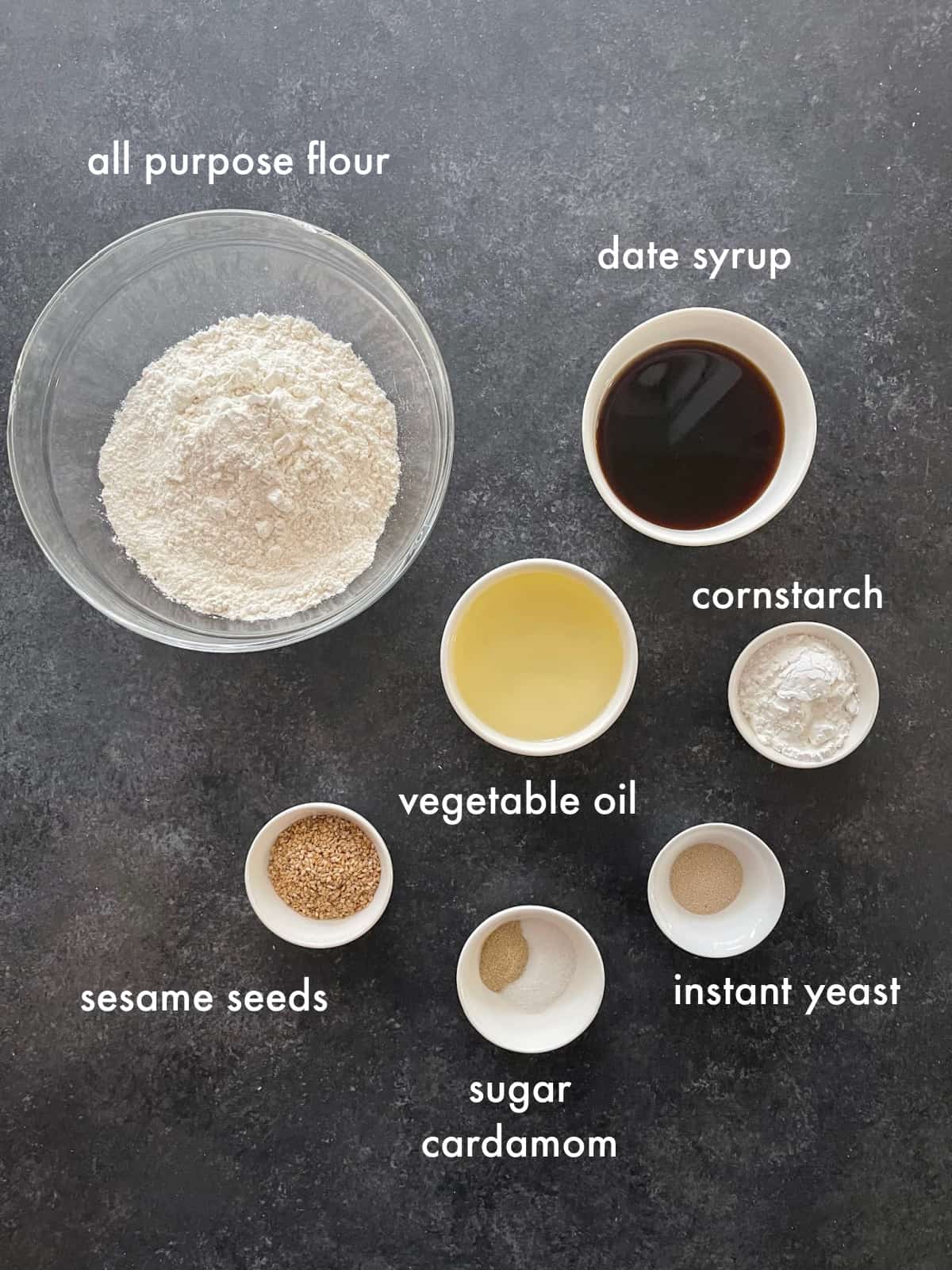 to make luqaimat you need flour, yeast, salt, sugar, cardamom, water, oil and date syrup. 