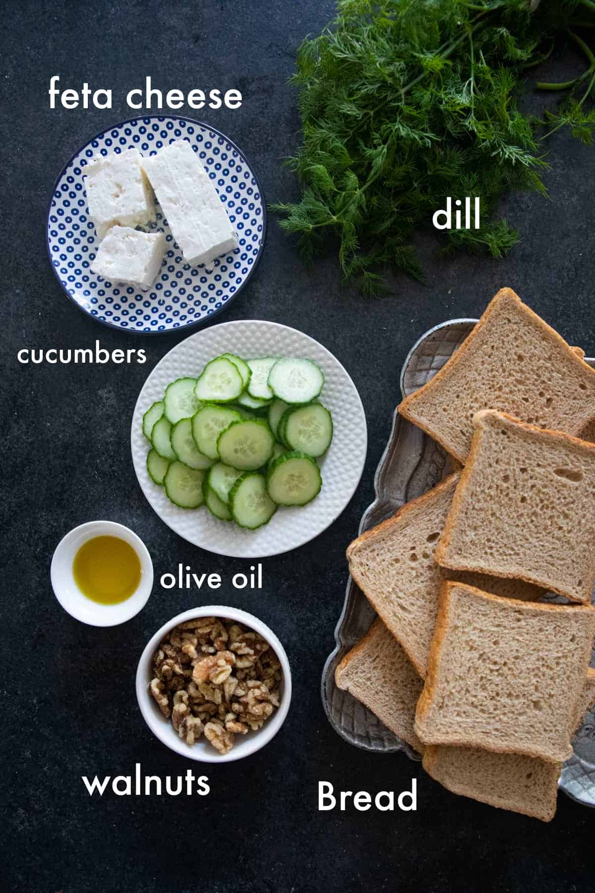 You need feta, walnuts, herbs, cucumbers and bread for this recipe. 
