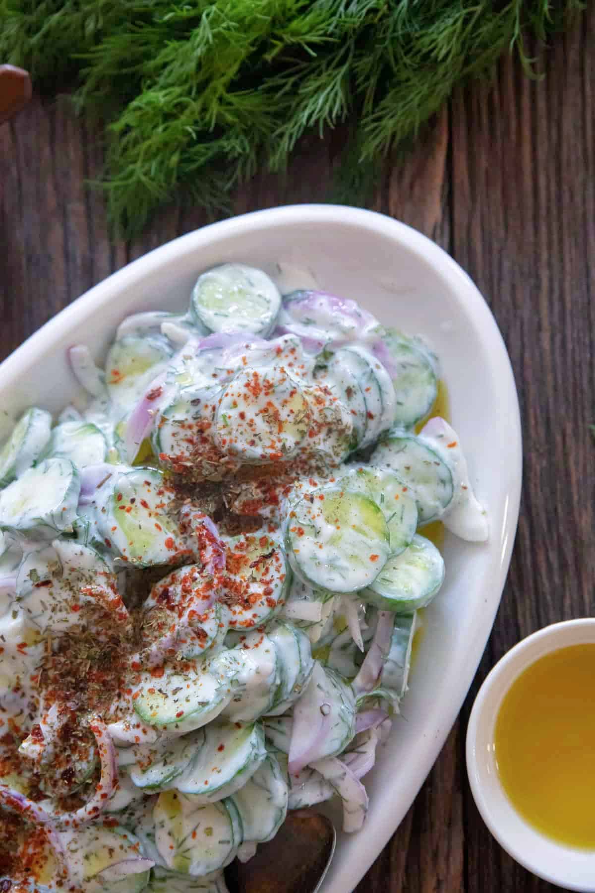 Close up shot of cucumber salad with yogurt. 