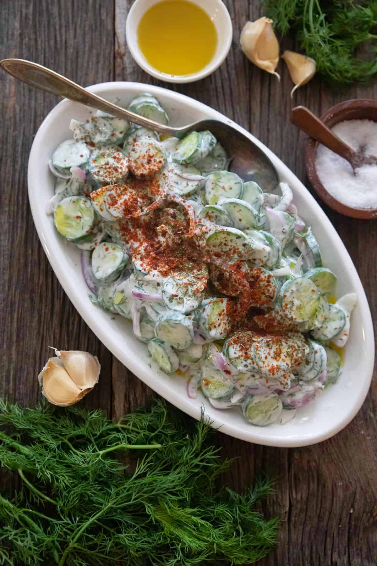 Creamy cucumber salad with yogurt on a large platter. 