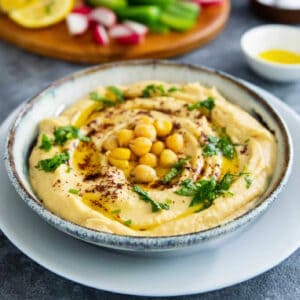 roasted garlic hummus topped with chickpeas and olive oil.