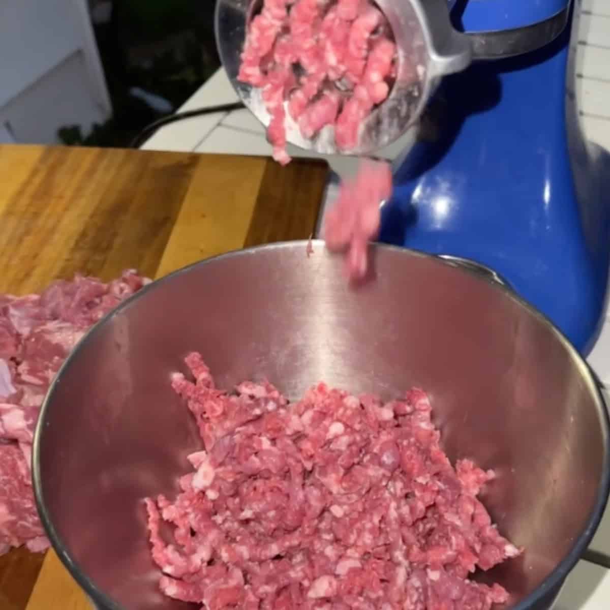 Begin by thoroughly mixing ground meat and grated onion until well combined. If available, use a meat grinder or the meat grinder attachment for a stand mixer to process the ground beef, lamb, and onion once, then continue mixing by hand.