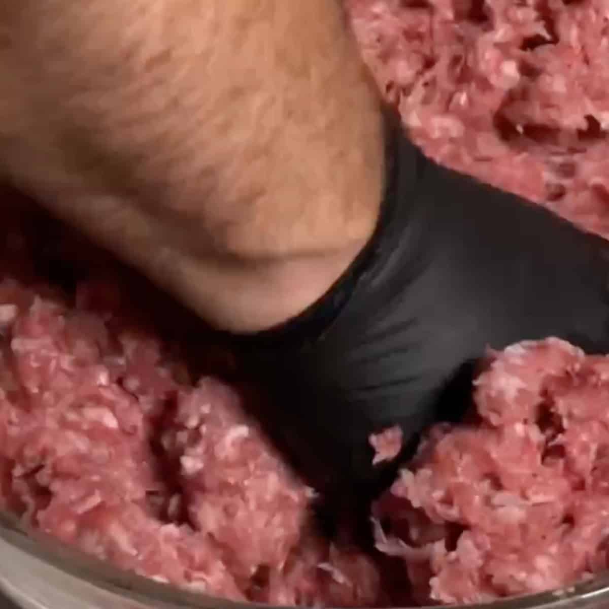 Begin by thoroughly mixing ground meat and grated onion until well combined. If available, use a meat grinder or the meat grinder attachment for a stand mixer to process the ground beef, lamb, and onion once, then continue mixing by hand.