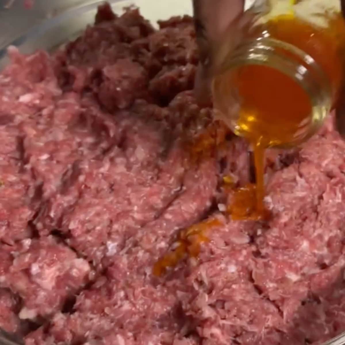 Add bloomed saffron, salt, and pepper to the meat and onion mixture. Knead the mixture by hand for an additional 10 minutes. Cover the mixture and refrigerate for one hour.