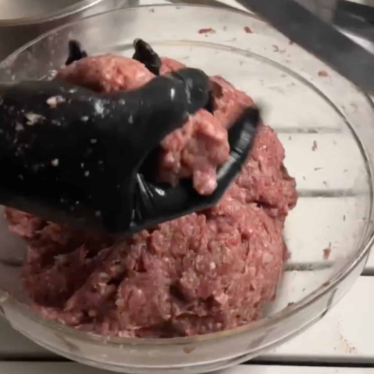 When ready to grill, remove the mixture from the fridge and keep a bowl of warm water nearby to prevent sticking. Take a handful of the mixture and shape it into an oval ball. Press the ball onto a 1-inch wide skewer. Wet your hands again and use your fingers to spread the meat along the skewer, forming a 6-inch long kebab with a thickness of ¼ to ½ inch on each side.