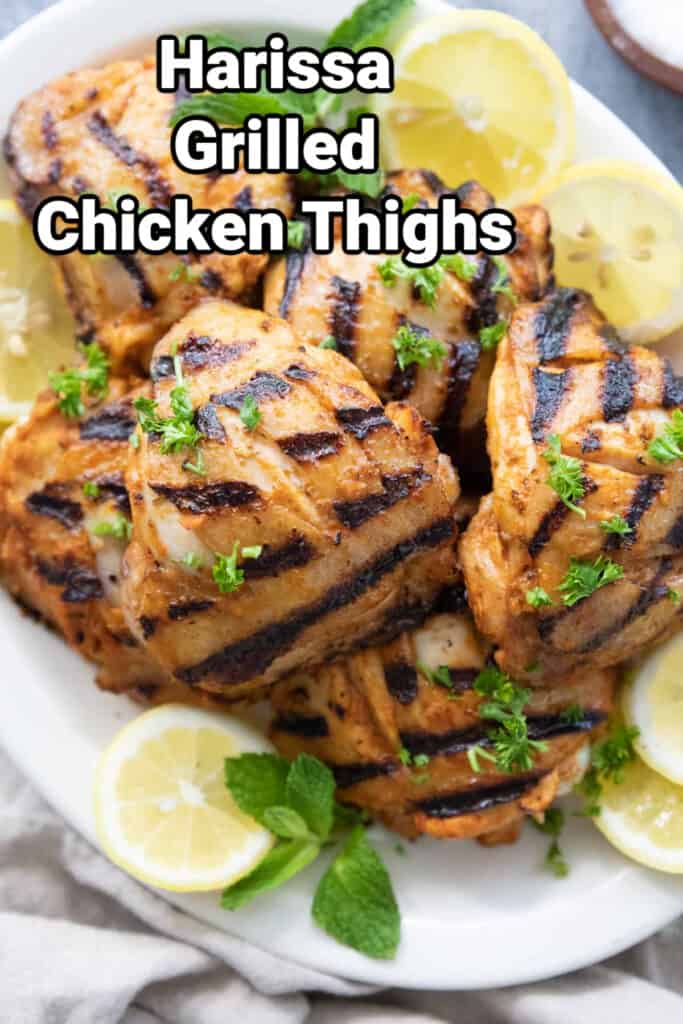 Grilled chicken thighs with harissa and garlic.