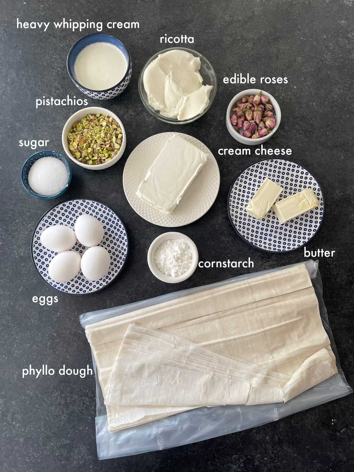 To make this recipe you need phyllo dough, cream cheese, ricotta, butter, heavy cream, pistachios, eggs, cornstarch and sugar.