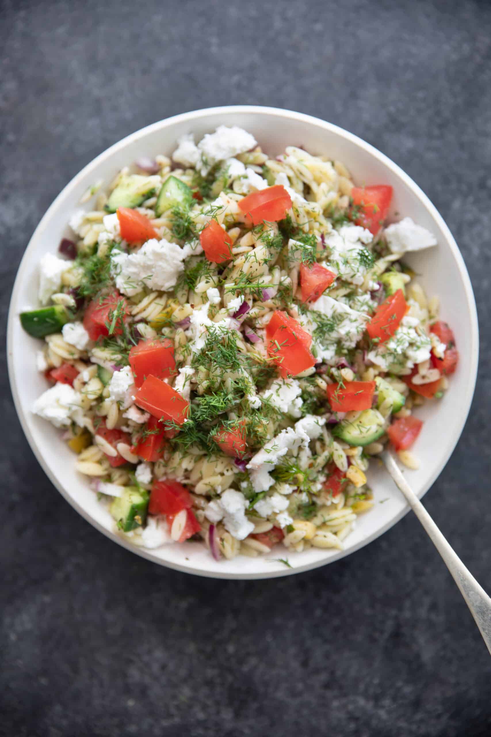 You can add tomatoes to the orzo salad if desired. 