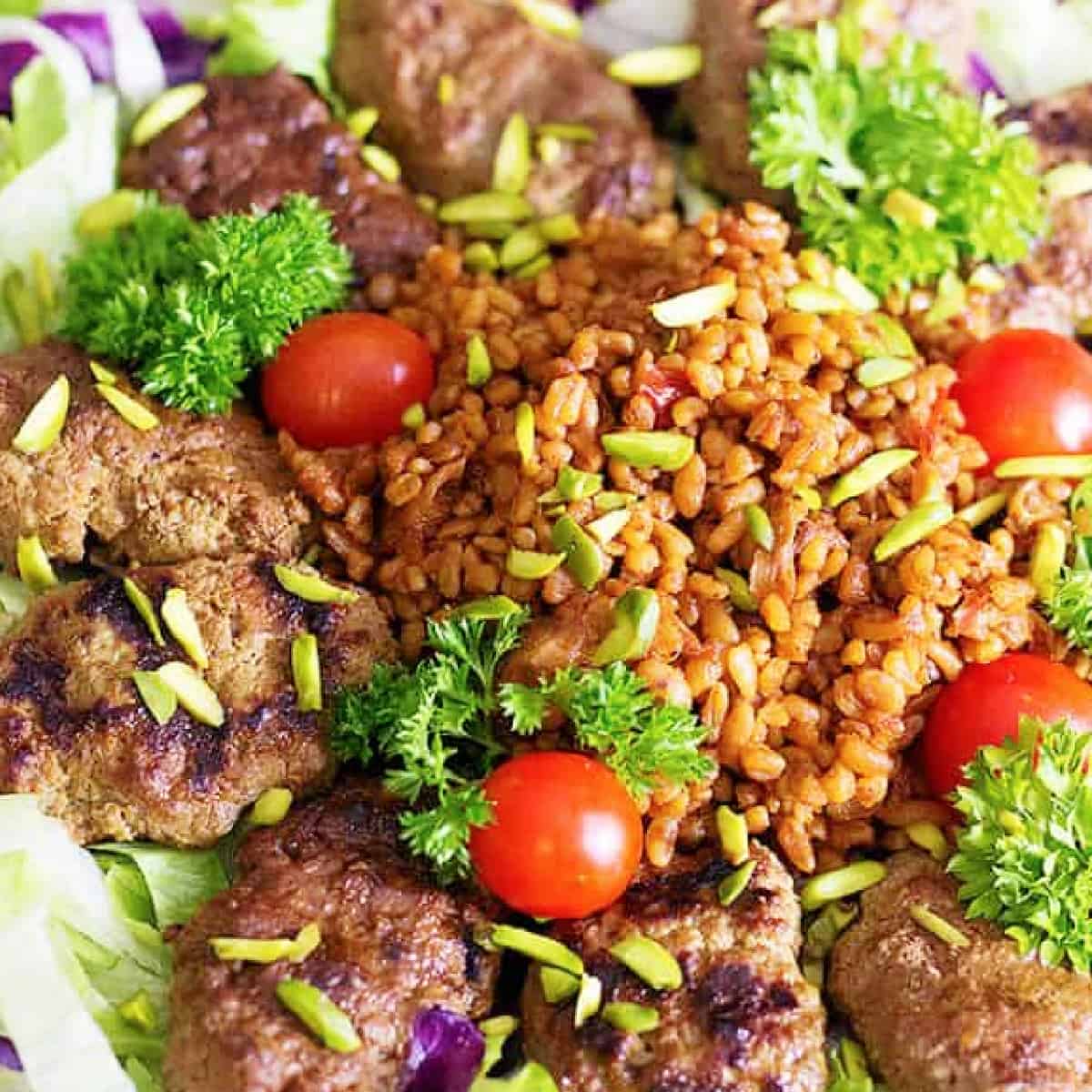 Spice up your usual meals with this Pomegranate Pistachio Koftas with Bulgur. Grilled koftas served with a delicious bulgur make the perfect meal!
