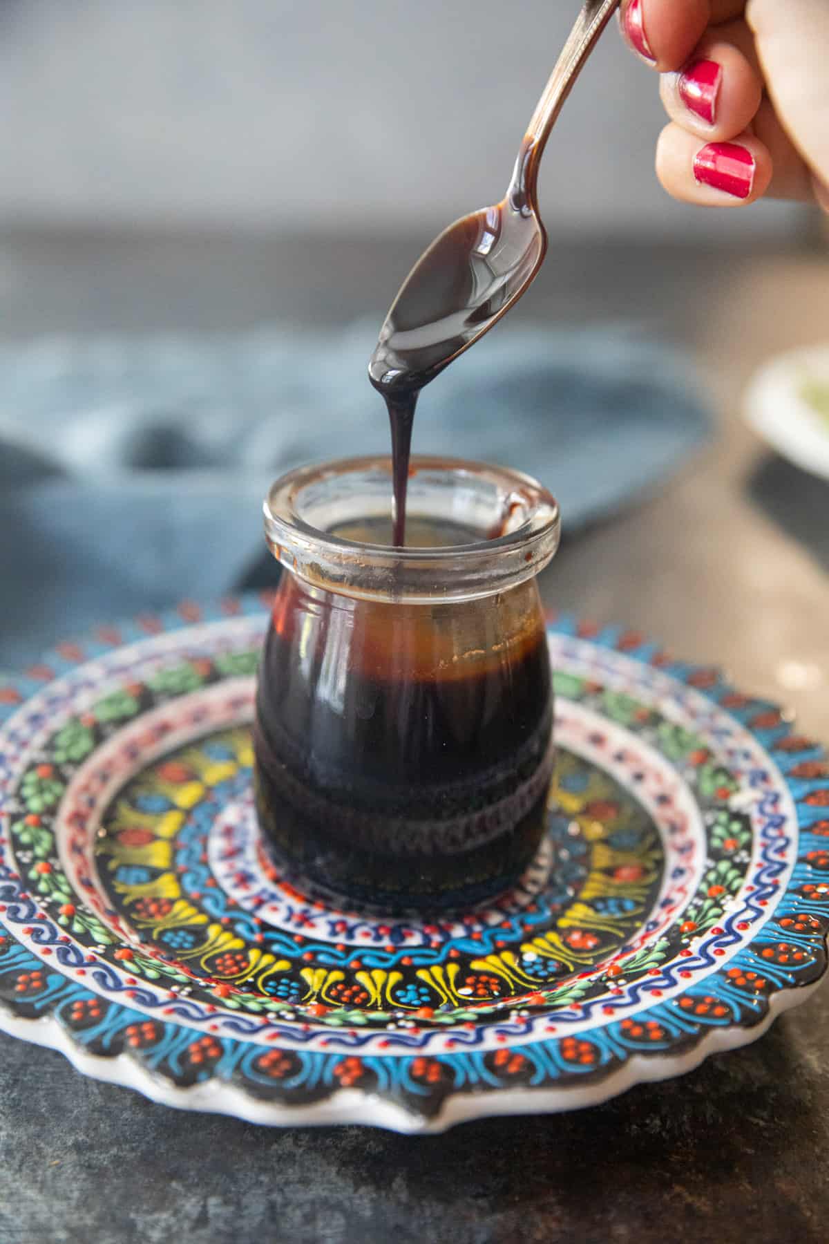 Pomegranate molasses in a jar.