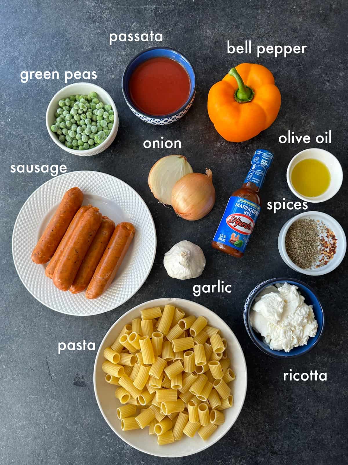 To make this recipe you need pasta, sausage, vegetables, spices, passata, hot sauce, and ricotta. 