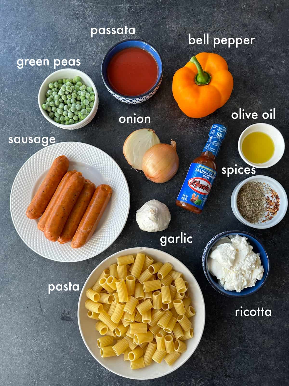 To make this recipe you need pasta, sausage, vegetables, spices, passata, hot sauce, and ricotta.